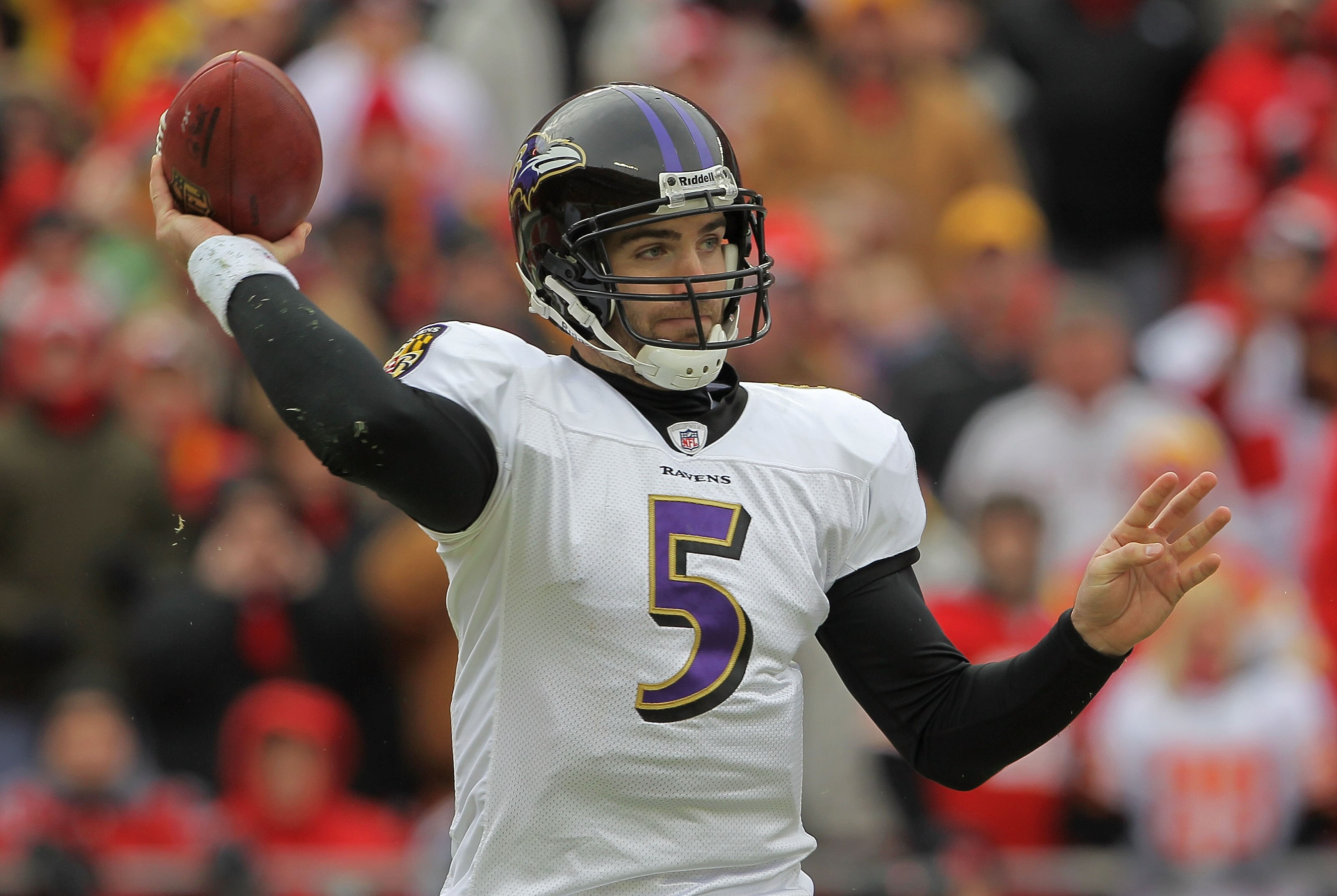 KANSAS CITY, MO - JANUARY 09:  Quarterback Joe Flacco #5 of the Baltimore Ravens throws a pass against the Kansas City Chiefs in their 2011 AFC wild card playoff game at Arrowhead Stadium on January 9, 2011 in Kansas City, Missouri.  (Photo by Doug Pensin