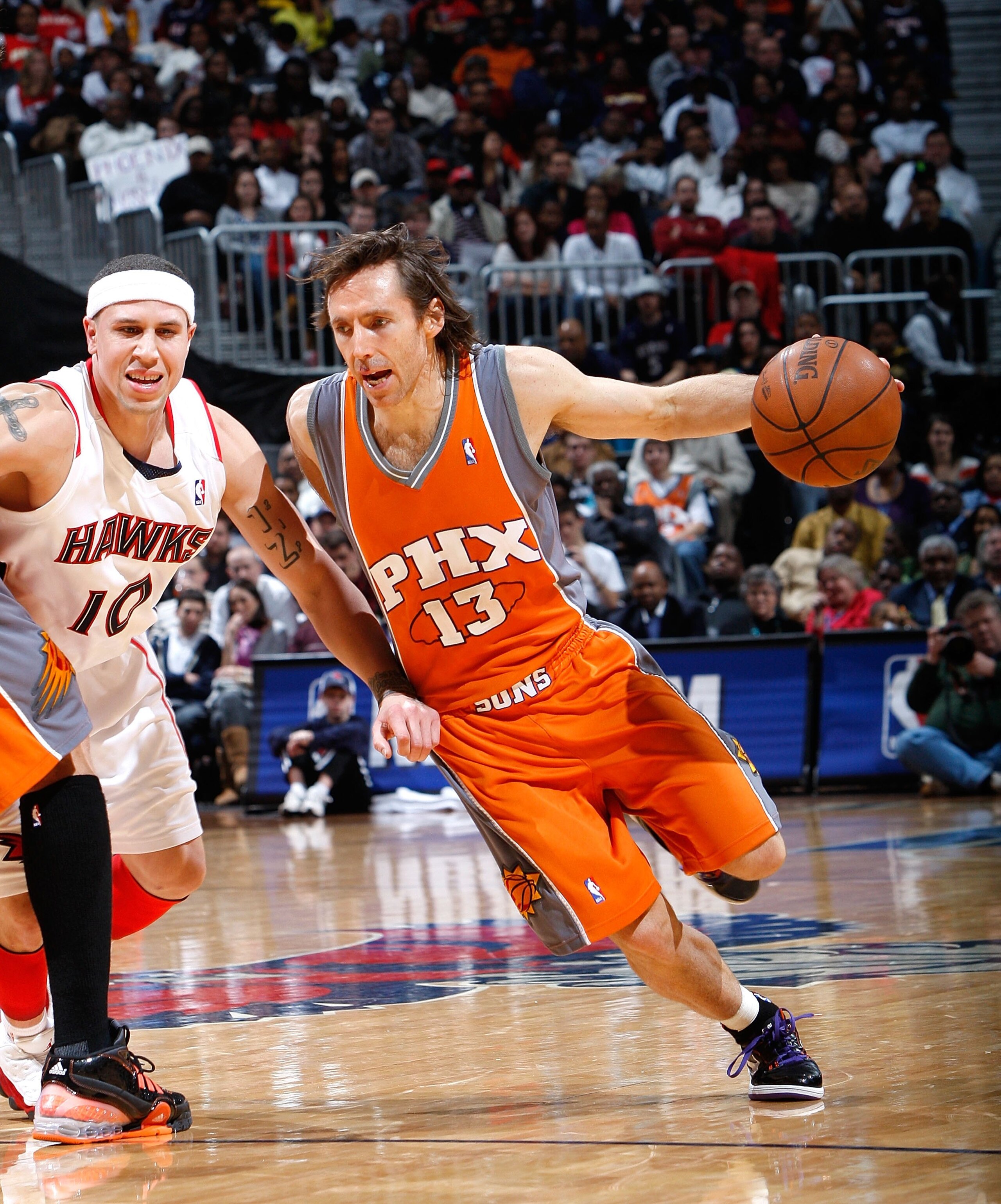 ATLANTA - JANUARY 15: Steve Nash #13 of the Phoenix Suns against Mike Bibby #10 of the Atlanta Hawks at Philips Arena on January 15, 2010 in Atlanta, Georgia. NOTE TO USER: User expressly acknowledges and agrees that, by downloading and/or using this Ph ATLANTA - JANUARY 15: Steve Nash #13 of the Phoenix Suns against Mike Bibby #10 of the Atlanta Hawks at Philips Arena on January 15, 2010 in Atlanta, Georgia. NOTE TO USER: User expressly acknowledges and agrees that, by downloading and/or using this Ph