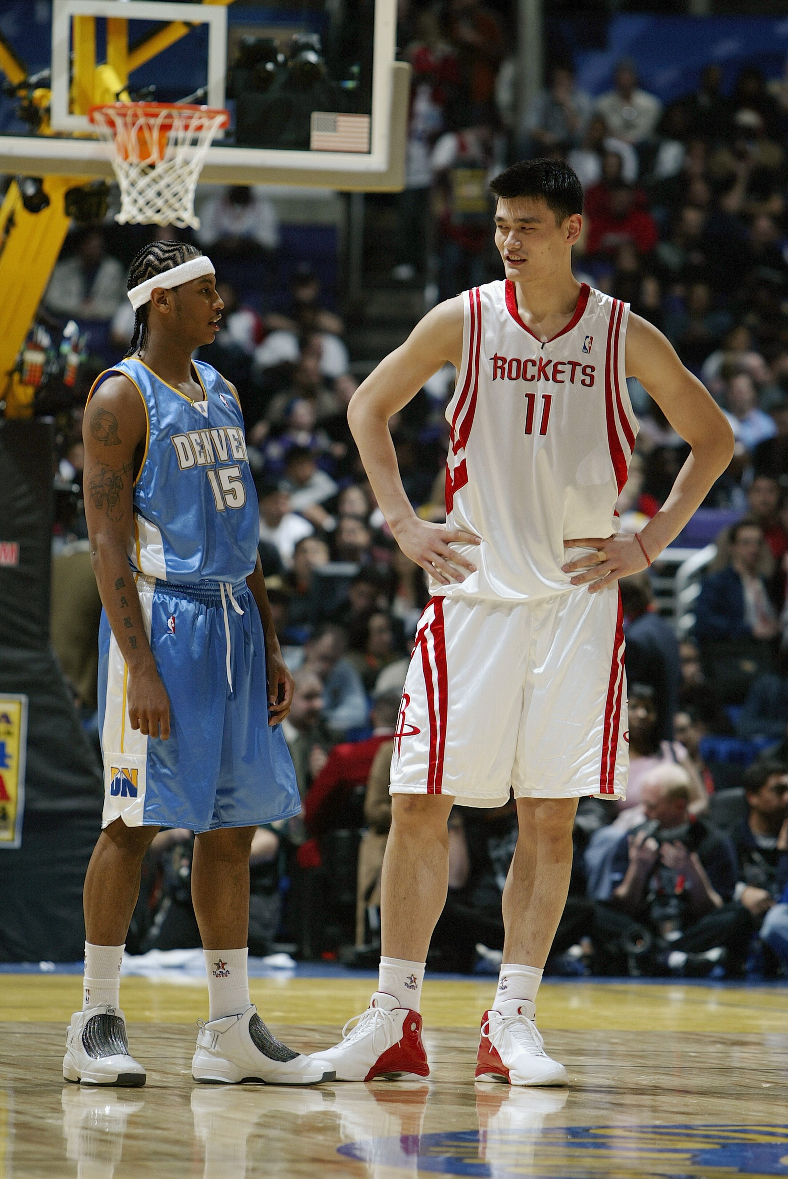 LOS ANGELES - FEBRUARY 13: Carmelo Anthony #15 of the Rookie Team stands next Yao Ming #11 of the Sophomore Team during the Got Milk? Rookie Challenge, part of the 53rd NBA All-Star weekend, at Staples Center on February 13, 2004 in Los Angeles, Califor LOS ANGELES - FEBRUARY 13: Carmelo Anthony #15 of the Rookie Team stands next Yao Ming #11 of the Sophomore Team during the Got Milk? Rookie Challenge, part of the 53rd NBA All-Star weekend, at Staples Center on February 13, 2004 in Los Angeles, Califor