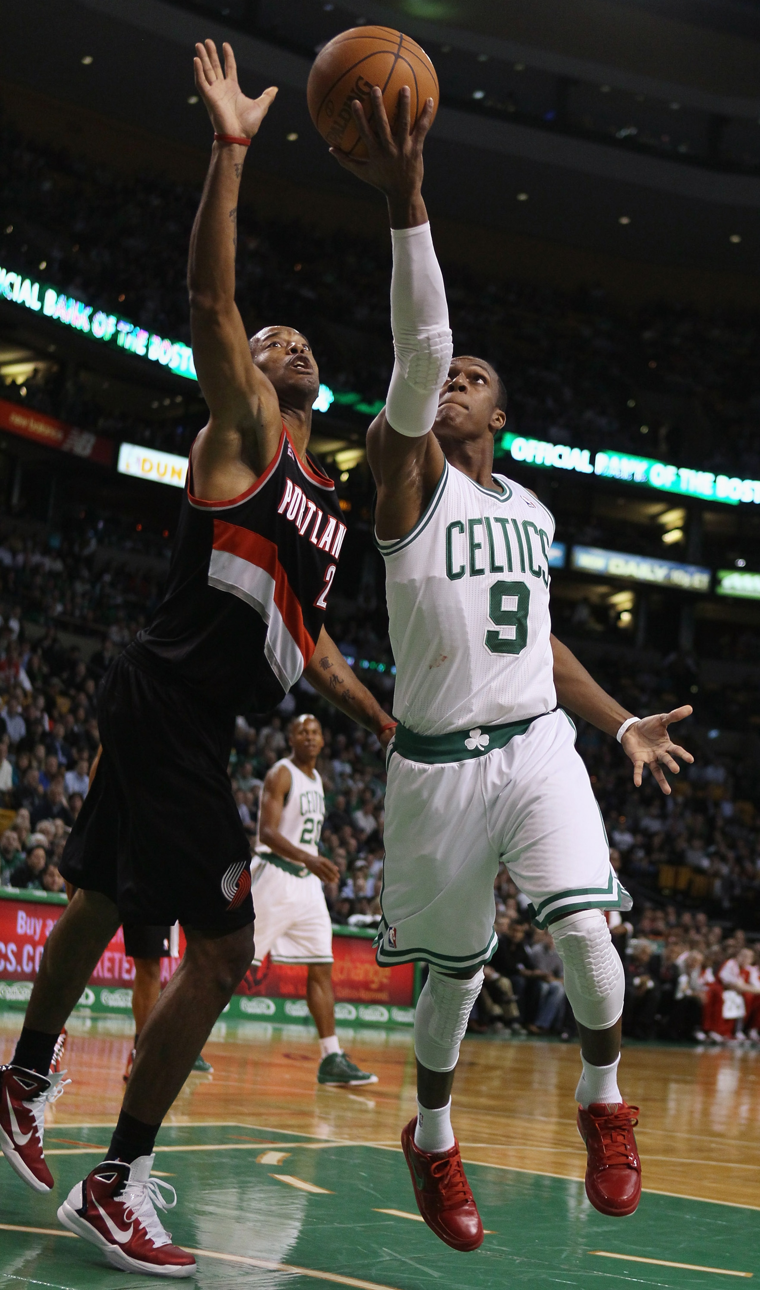 BOSTON - DECEMBER 01: Rajon Rondo #9 of the Boston Celtics heads for the basket as Marcus Camby #23 of the Portland Trailblazers defends on December 1, 2010 at the TD Garden in Boston, Massachusetts. NOTE TO USER: User expressly acknowledges and agrees BOSTON - DECEMBER 01: Rajon Rondo #9 of the Boston Celtics heads for the basket as Marcus Camby #23 of the Portland Trailblazers defends on December 1, 2010 at the TD Garden in Boston, Massachusetts. NOTE TO USER: User expressly acknowledges and agrees
