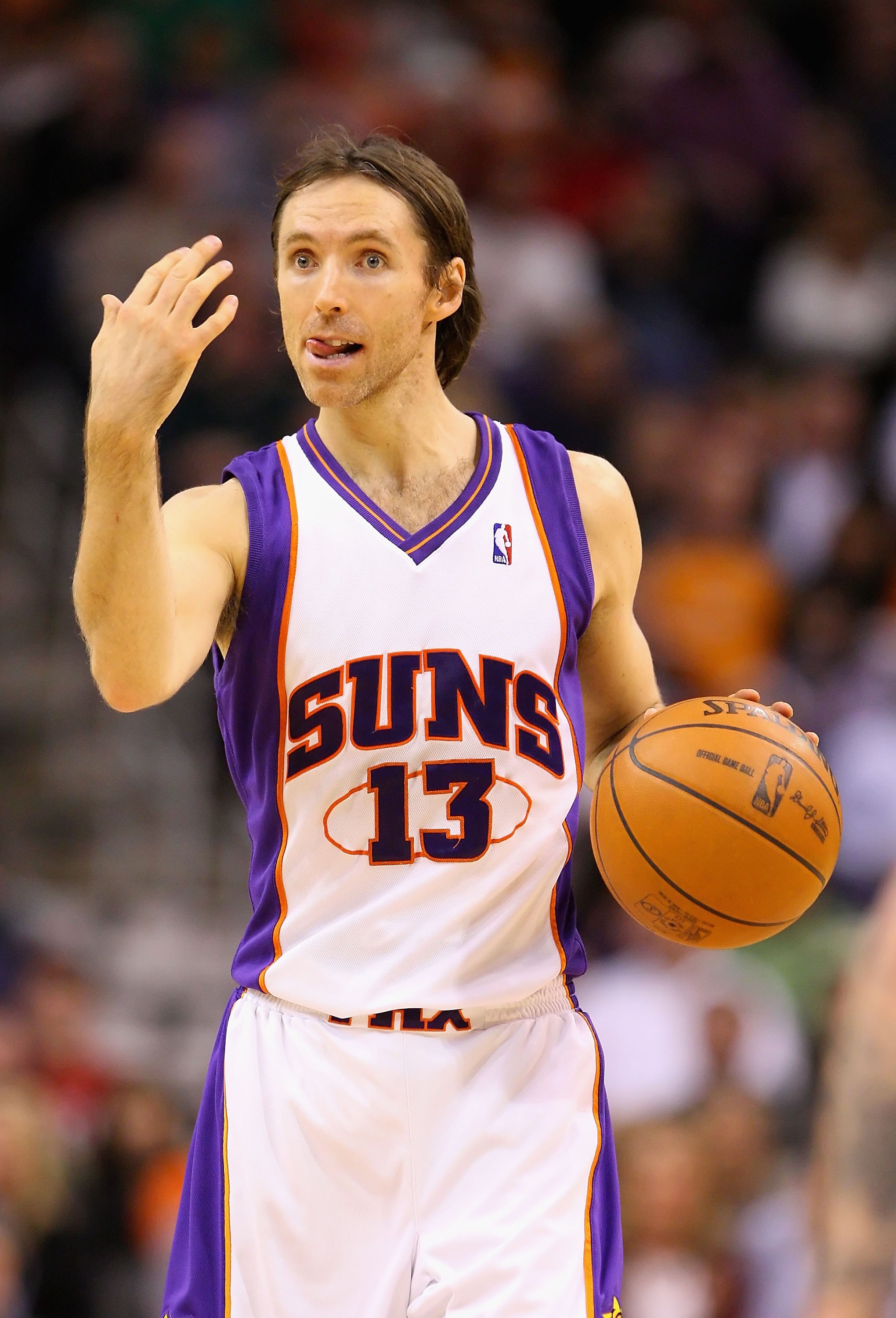 PHOENIX - DECEMBER 11:  Steve Nash #13 of the Phoenix Suns moves the ball upcourt during the NBA game against the Orlando Magic at US Airways Center on December 11, 2009 in Phoenix, Arizona. The Suns defeated the Magic 106-103.  NOTE TO USER: User express