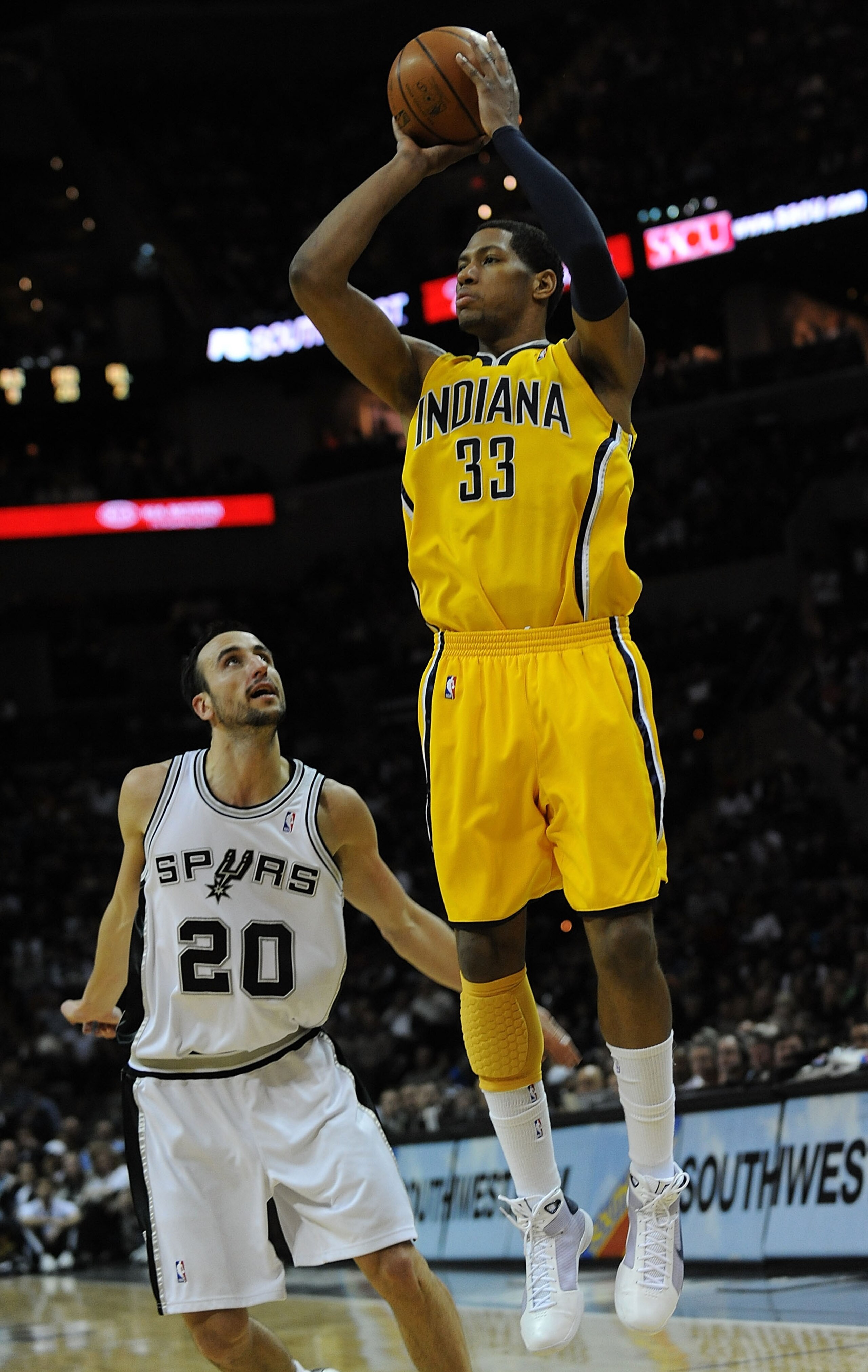 SAN ANTONIO - JANUARY 20: Forward Danny Granger #33 of the Indiana Pacers takes a shot against Manu Ginobili #20 of the San Antonio Spurs on January 20, 2009 at AT&T Center in San Antonio, Texas. NOTE TO USER: User expressly acknowledges and agrees that SAN ANTONIO - JANUARY 20: Forward Danny Granger #33 of the Indiana Pacers takes a shot against Manu Ginobili #20 of the San Antonio Spurs on January 20, 2009 at AT&T Center in San Antonio, Texas. NOTE TO USER: User expressly acknowledges and agrees that