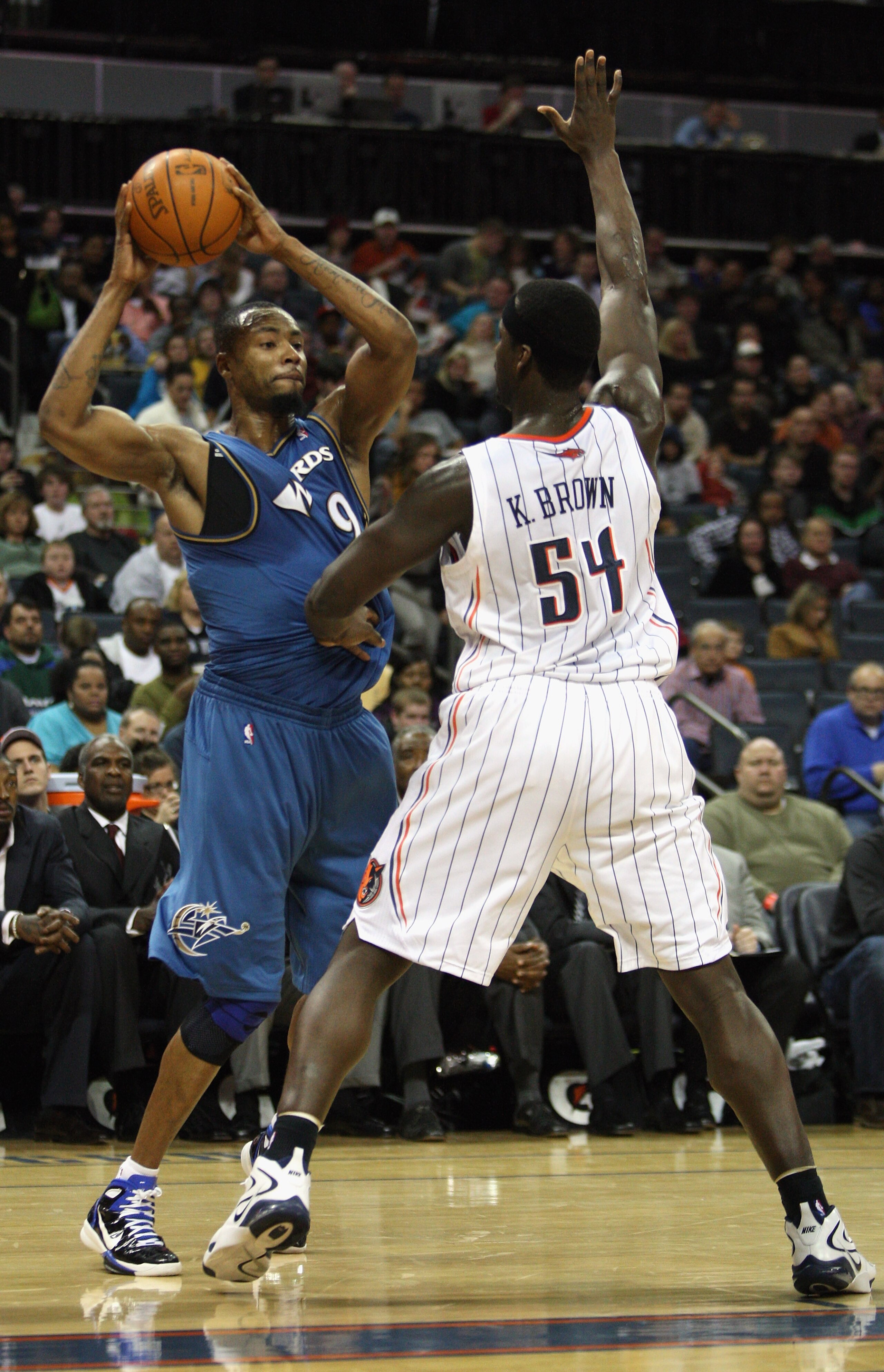 CHARLOTTE, NC - JANUARY 08: Rashard Lewis #9 of the Washington Wizards looks to pass the ball around Kwame Brown #54 of the Charlotte Bobcats during their game at Time Warner Cable Arena on January 8, 2011 in Charlotte, North Carolina. NOTE TO USER: User CHARLOTTE, NC - JANUARY 08: Rashard Lewis #9 of the Washington Wizards looks to pass the ball around Kwame Brown #54 of the Charlotte Bobcats during their game at Time Warner Cable Arena on January 8, 2011 in Charlotte, North Carolina. NOTE TO USER: User