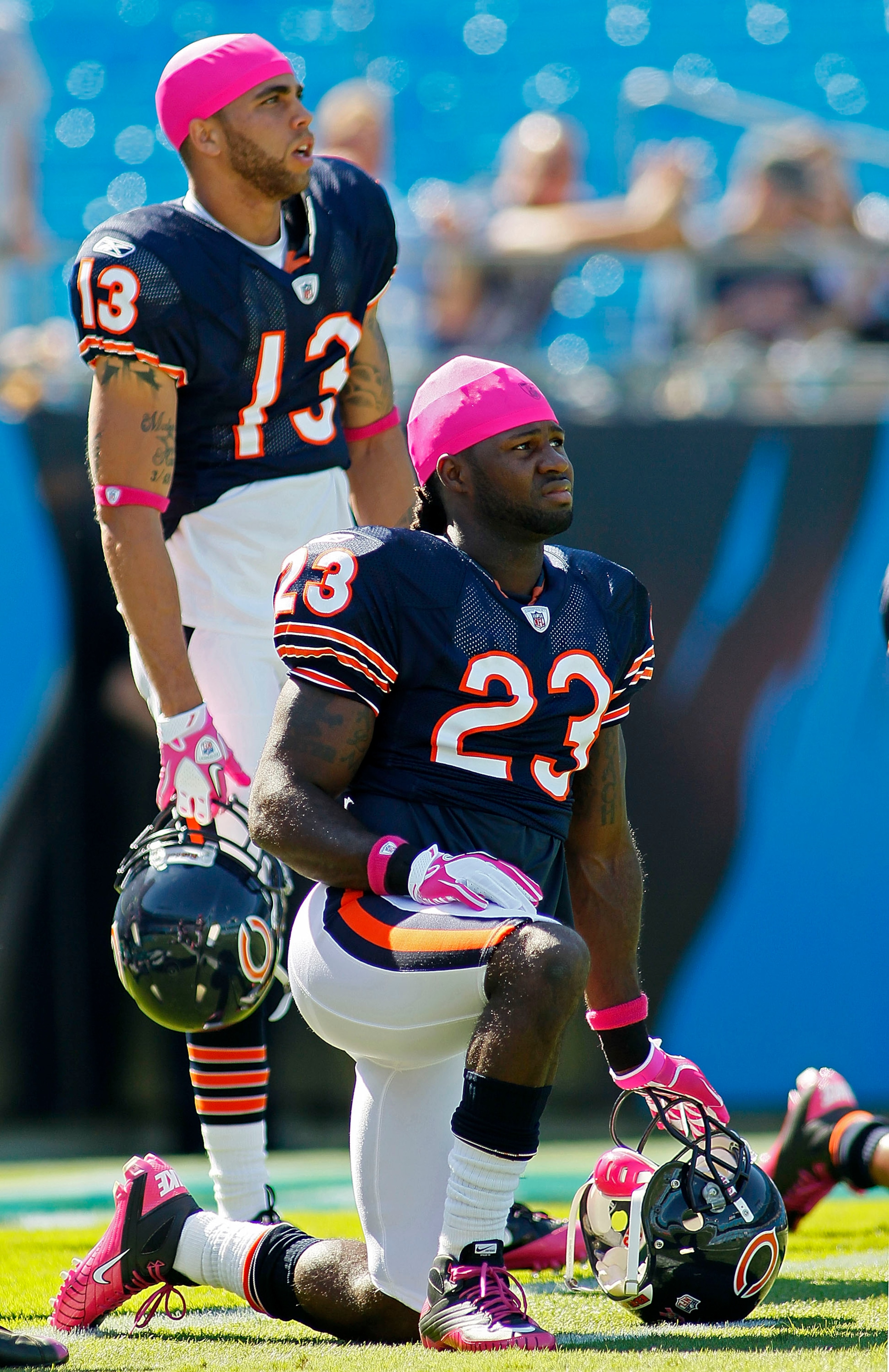 CHARLOTTE, NC - OCTOBER 10: Wide receiver Devin Hester #23 of the Chicago Bears kneels in front of wide receiver Johnny Knox #13 of the Chicago Bears during warm ups prior to the Bears game against the Carolina Panthers at Bank of America Stadium on Octob