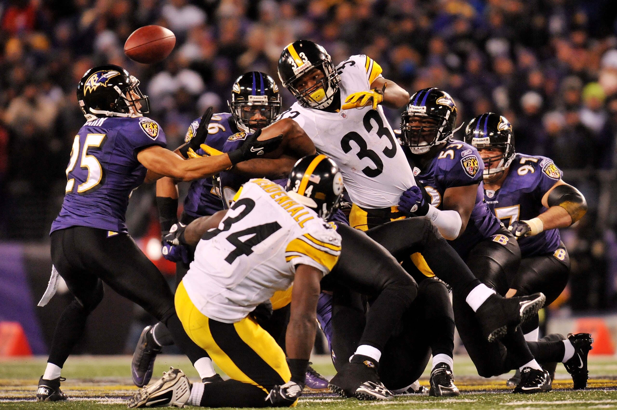 BALTIMORE, MD - DECEMBER 05: Running back Isaac Redman #33 of the Pittsburgh Steelers fumbles the ball which is recovered by teammate running back Rashard Mendenhall #34 during the second quarter of the game against the Baltimore Ravens at M&T Bank Stadi BALTIMORE, MD - DECEMBER 05: Running back Isaac Redman #33 of the Pittsburgh Steelers fumbles the ball which is recovered by teammate running back Rashard Mendenhall #34 during the second quarter of the game against the Baltimore Ravens at M&T Bank Stadi