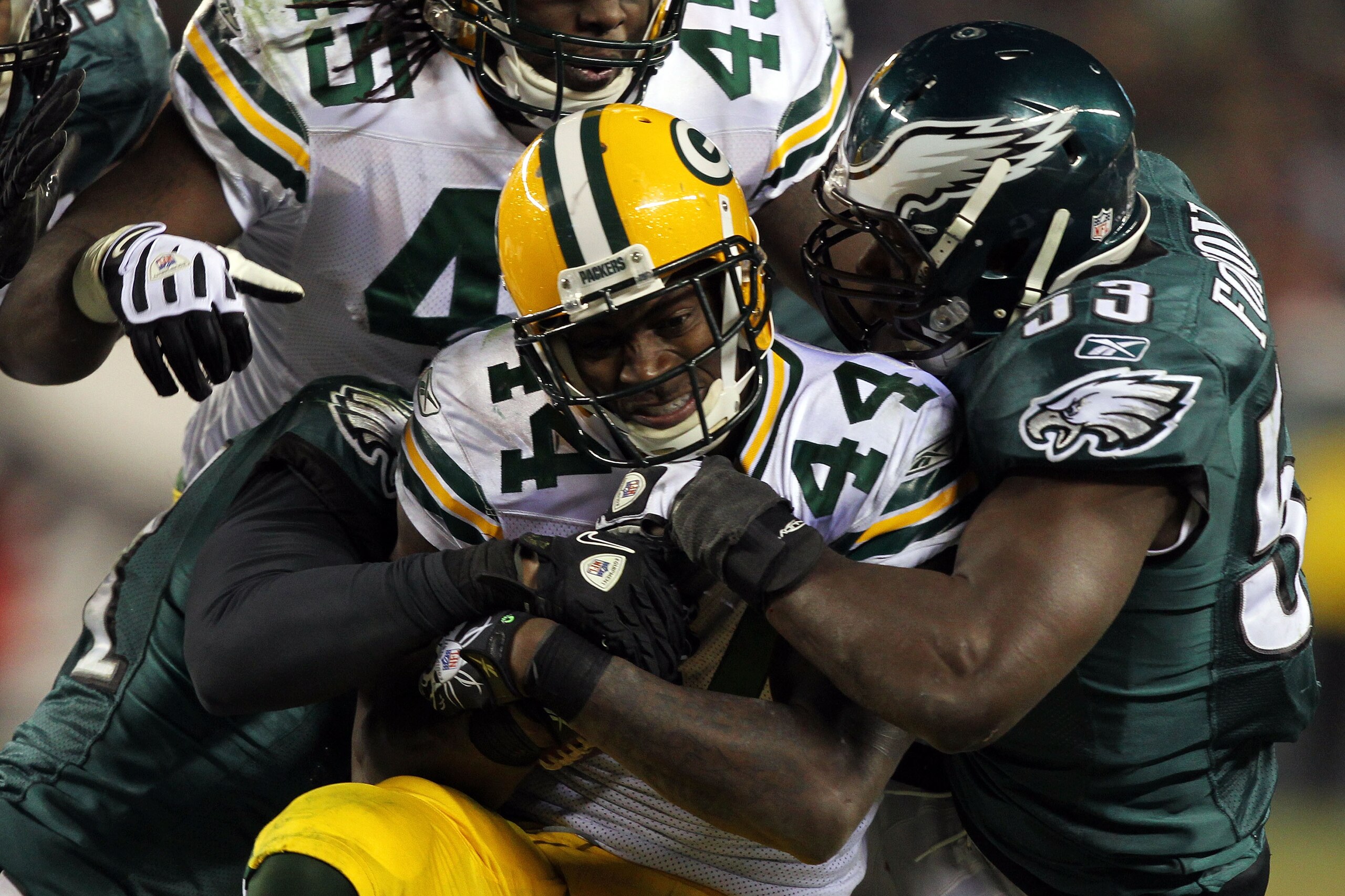 PHILADELPHIA, PA - JANUARY 09: James Starks #44 of the Green Bay Packers is tackled by Moise Fokou #53 of the Philadelphia Eagles during the 2011 NFC wild card playoff game at Lincoln Financial Field on January 9, 2011 in Philadelphia, Pennsylvania. (Ph PHILADELPHIA, PA - JANUARY 09: James Starks #44 of the Green Bay Packers is tackled by Moise Fokou #53 of the Philadelphia Eagles during the 2011 NFC wild card playoff game at Lincoln Financial Field on January 9, 2011 in Philadelphia, Pennsylvania. (Ph