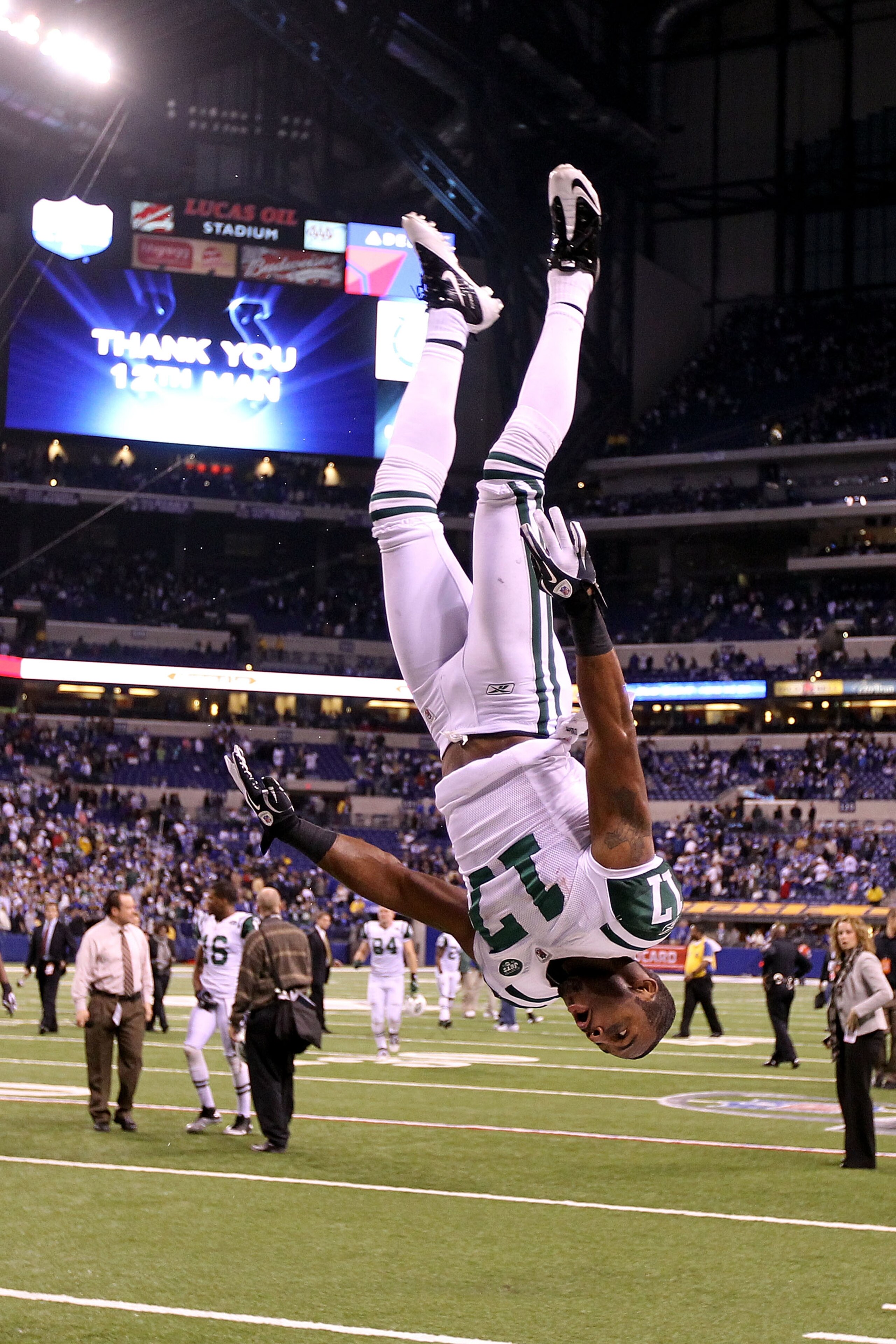INDIANAPOLIS, IN - JANUARY 08:  Braylon Edwards #17 of the New York Jets does a flip in celebration of the Jets 17-16 win against the Indianapolis Colts during their 2011 AFC wild card playoff game at Lucas Oil Stadium on January 8, 2011 in Indianapolis,