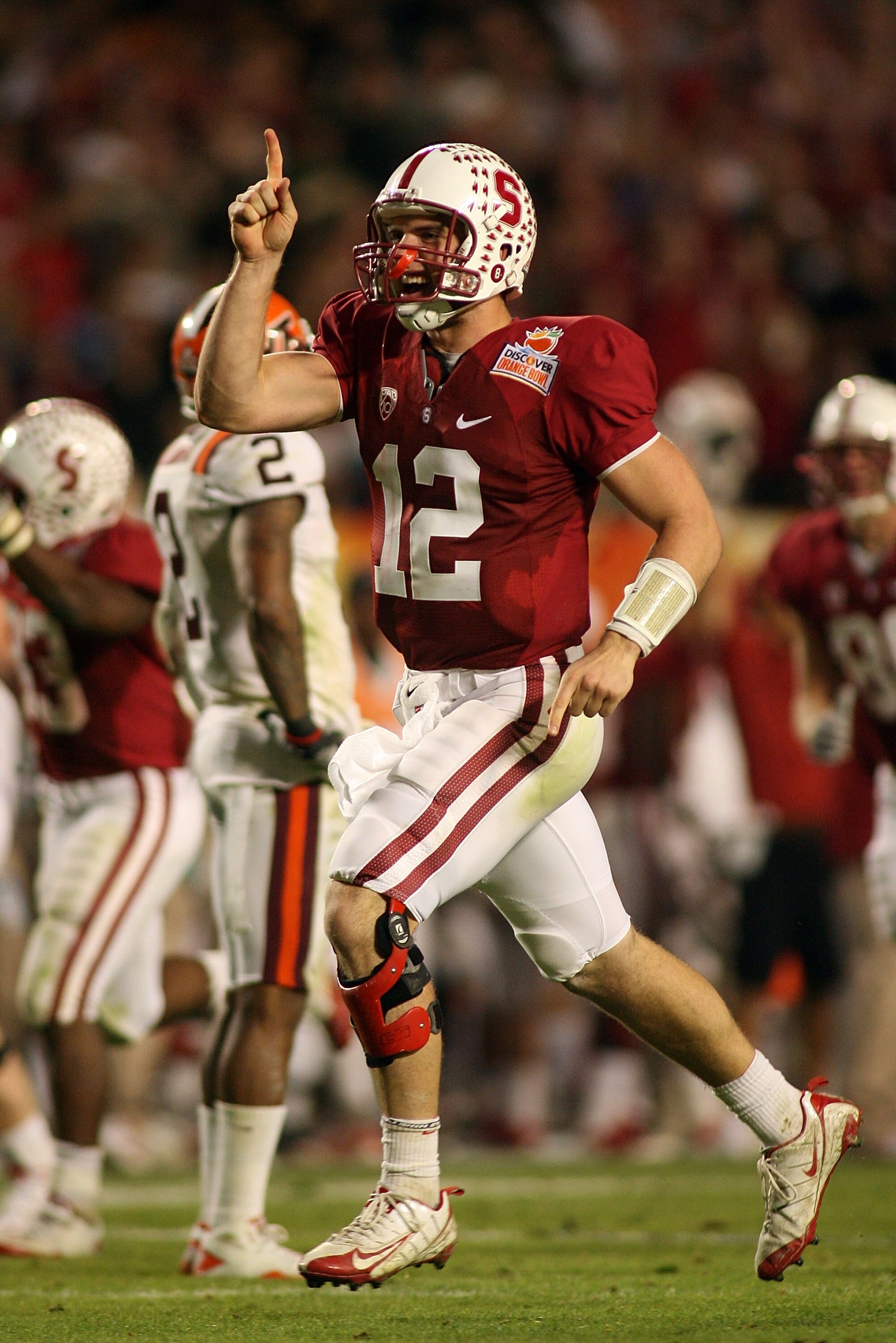 MIAMI, FL - JANUARY 03: Andrew Luck #12 of the Stanford Cardinal celebrates after he threw a 41-yard touchdown pass to Coby Fleener #82 in the third quarterback against the Virginia Tech Hokies during the 2011 Discover Orange Bowl at Sun Life Stadium on J
