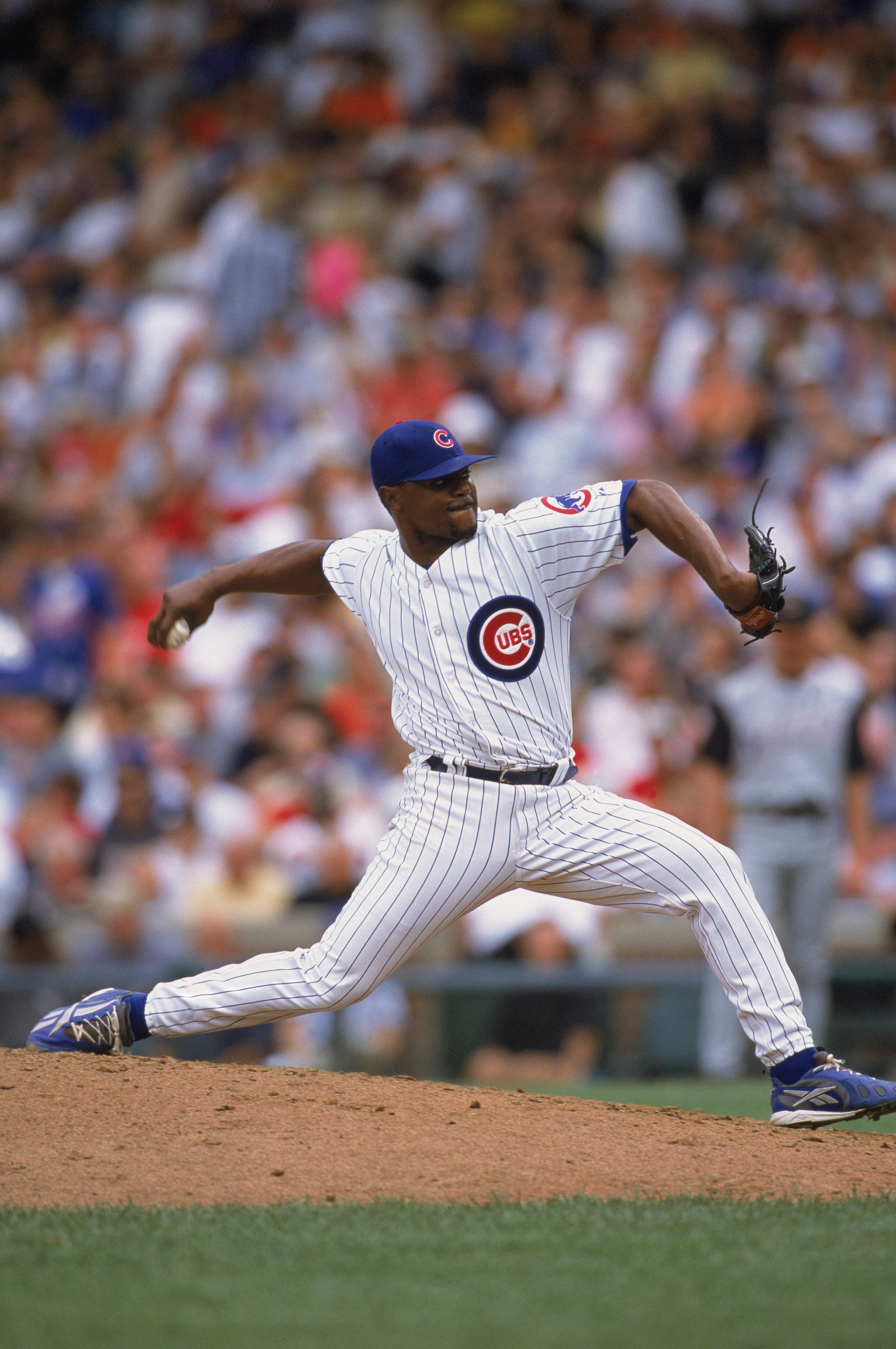 CHICAGO - AUGUST 16:  Flash Gordon #45 of the Chicago Cubs pitches the ball during their Game against the Arizona Diamondbacks at Wrigley field in Chicago, Illinois on August 16, 2002. The Diamondbacks defeated the Cubs 2-1. (Photo by:  Jonathan Daniel/Ge