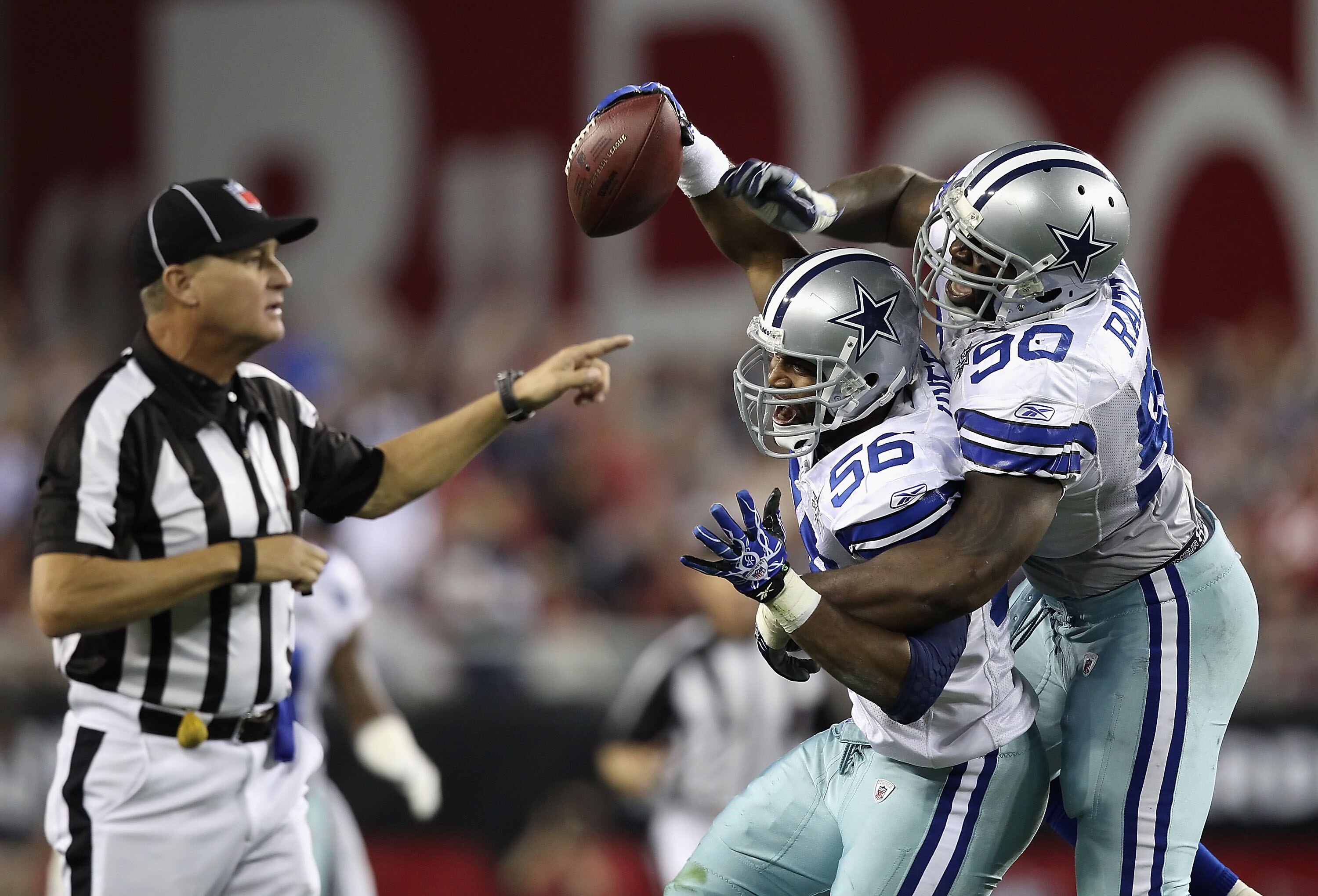 GLENDALE, AZ - DECEMBER 25:  Linebacker Bradie James #56 of the Dallas Cowboys celebrates with teammate Jay Ratliff #90 after a possible interception agianst the Arizona Cardinals during the NFL game at the University of Phoenix Stadium on December 25, 20