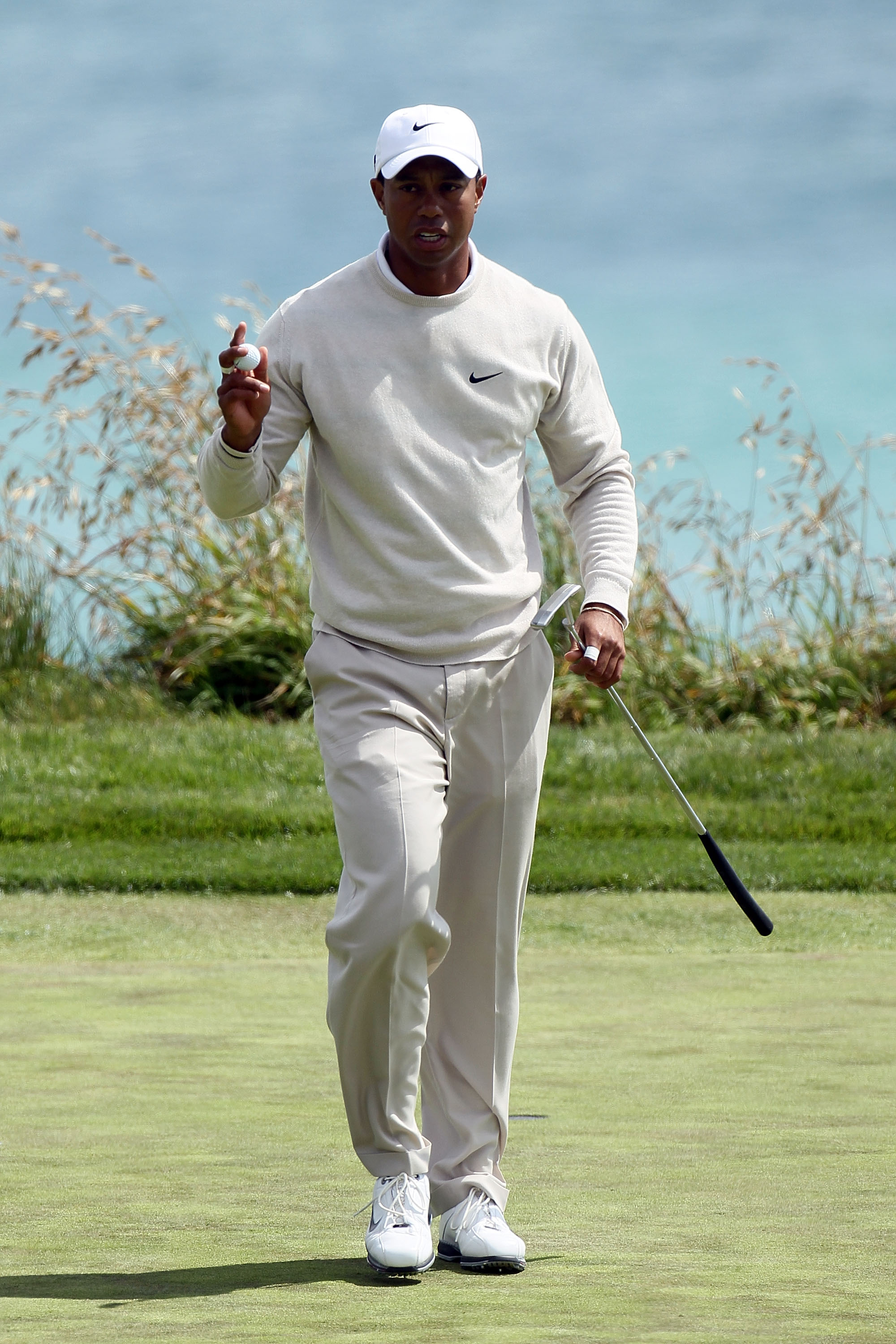 PEBBLE BEACH, CA - JUNE 19:  Tiger Woods walks off the tenth green during the third round of the 110th U.S. Open at Pebble Beach Golf Links on June 19, 2010 in Pebble Beach, California.  (Photo by Stephen Dunn/Getty Images)
