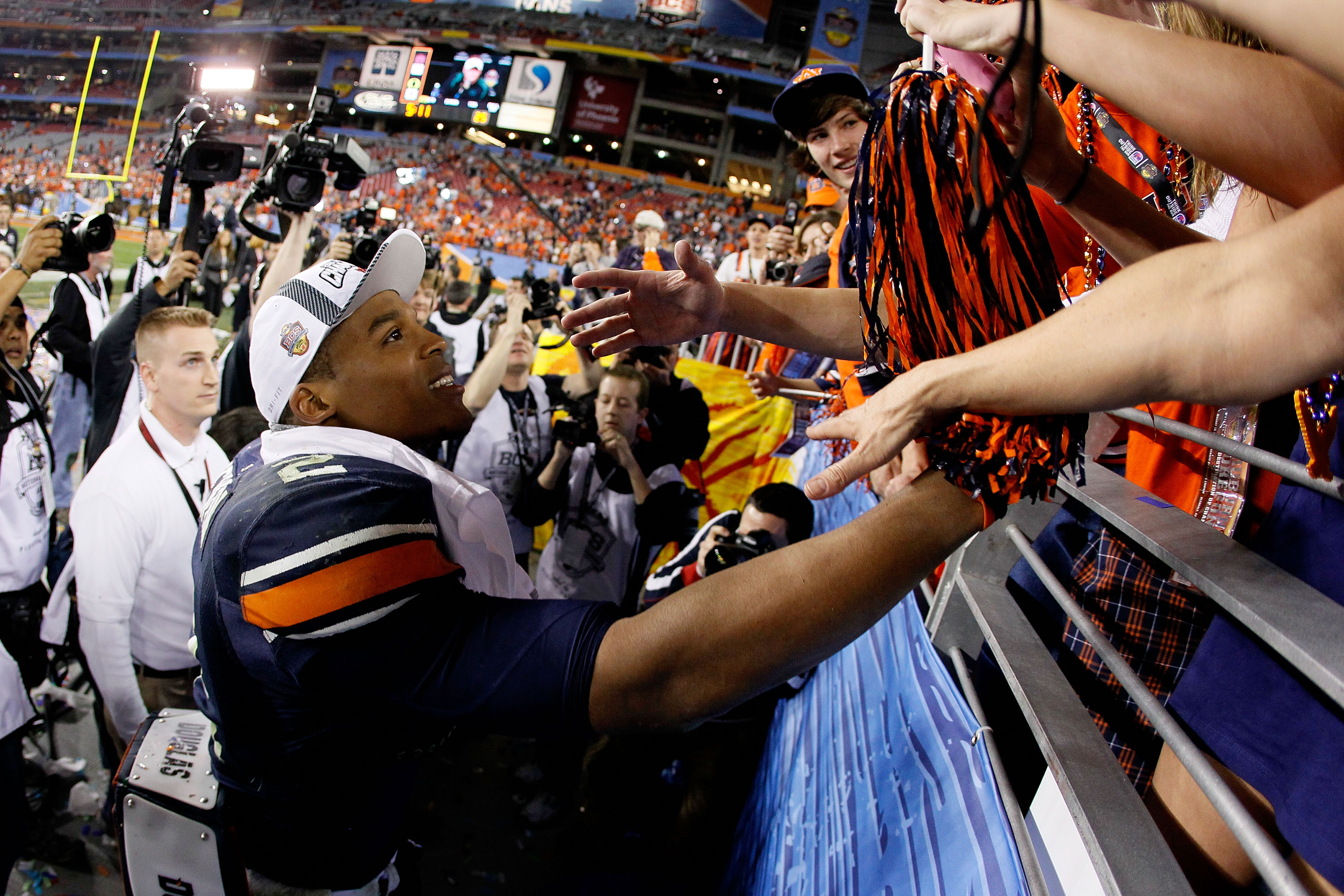 GLENDALE, AZ - JANUARY 10:  Quarterback Cameron Newton #2 of the Auburn Tigers celebrates the Tigers 22-19 victory against the Oregon Ducks in the Tostitos BCS National Championship Game at University of Phoenix Stadium on January 10, 2011 in Glendale, Ar