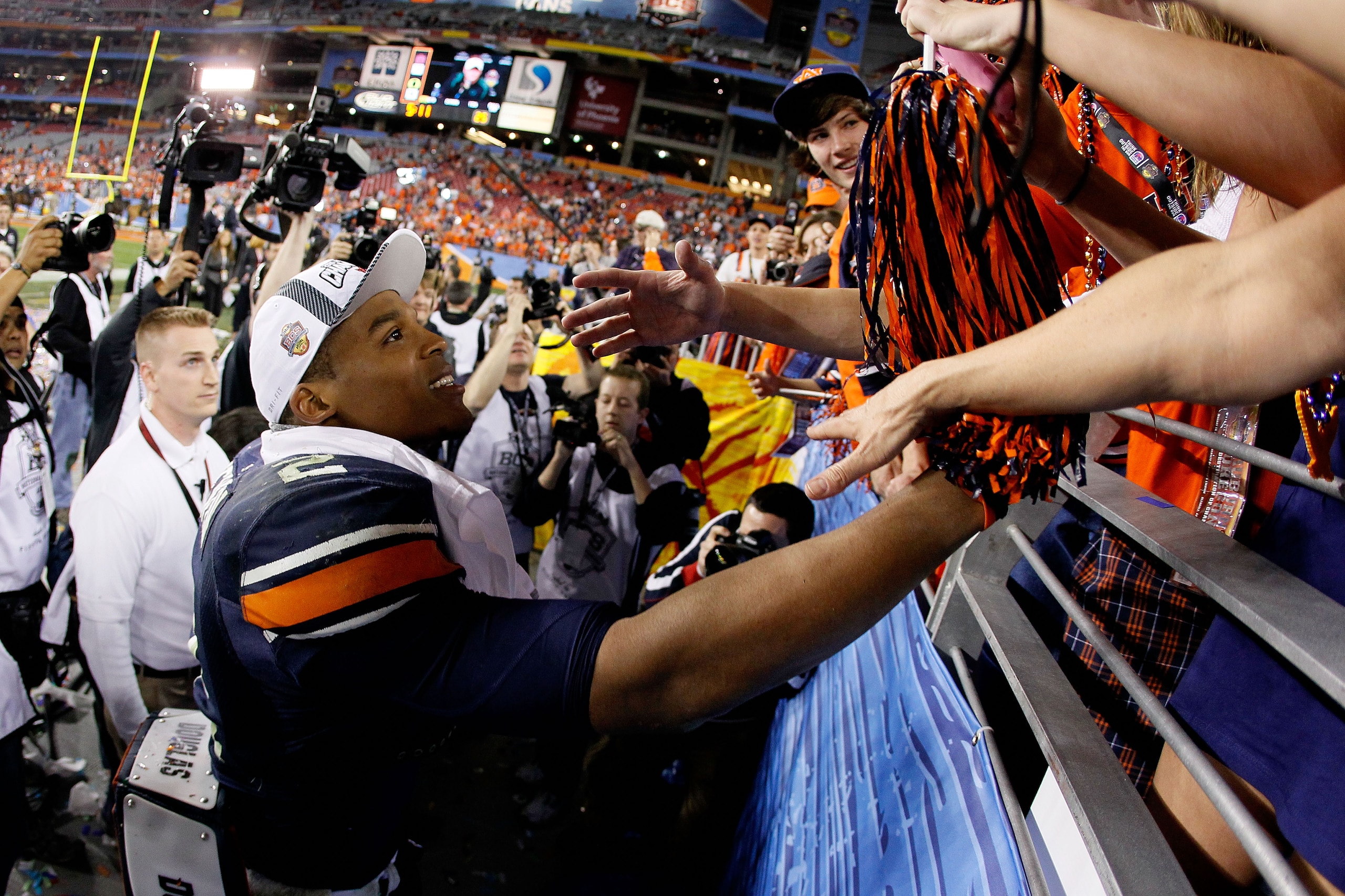 GLENDALE, AZ - JANUARY 10:  Quarterback Cameron Newton #2 of the Auburn Tigers celebrates the Tigers 22-19 victory against the Oregon Ducks in the Tostitos BCS National Championship Game at University of Phoenix Stadium on January 10, 2011 in Glendale, Ar