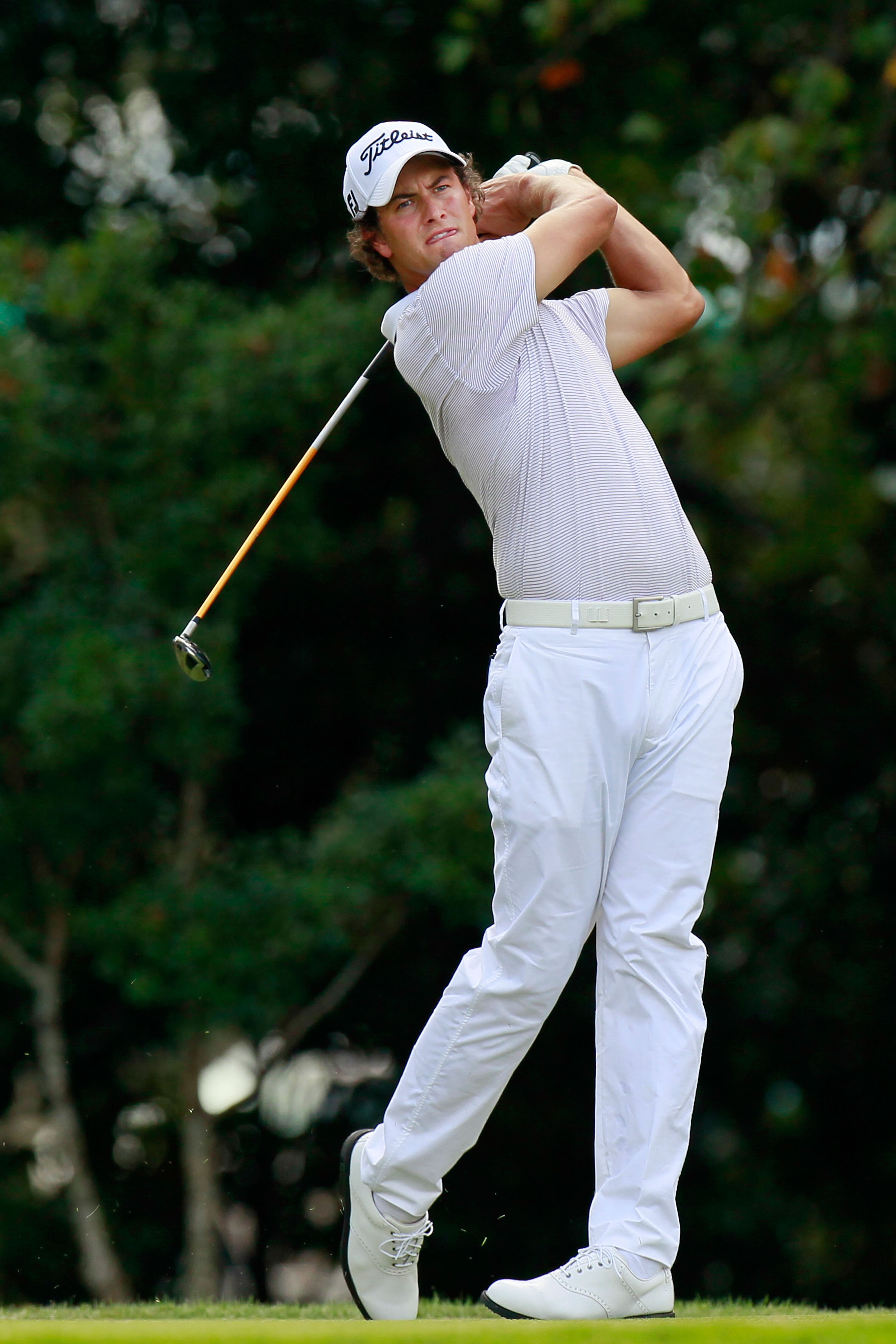 ATLANTA - SEPTEMBER 23:  Adam Scott of Australia hits his tee shot on the eighth hole during the first round of THE TOUR Championship presented by Coca-Cola at East Lake Golf Club on September 23, 2010 in Atlanta, Georgia.  (Photo by Kevin C. Cox/Getty Im