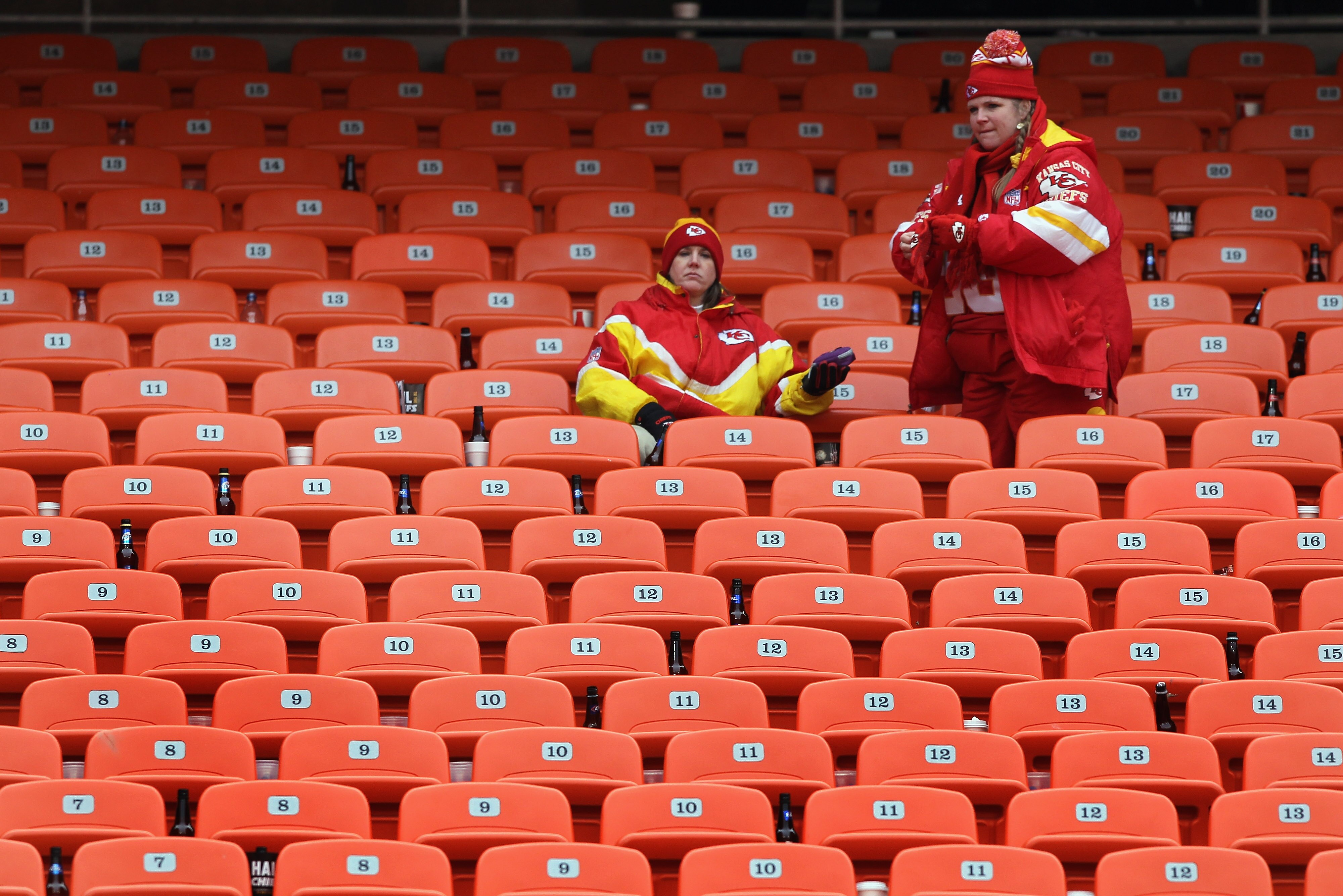 KANSAS CITY, MO - JANUARY 09:  Fans of the Kansas City Chiefs sit in the stands after the Baltimore Ravens defeated the Chiefs 30-7 in the 2011 AFC wild card playoff game at Arrowhead Stadium on January 9, 2011 in Kansas City, Missouri.  (Photo by Doug Pe