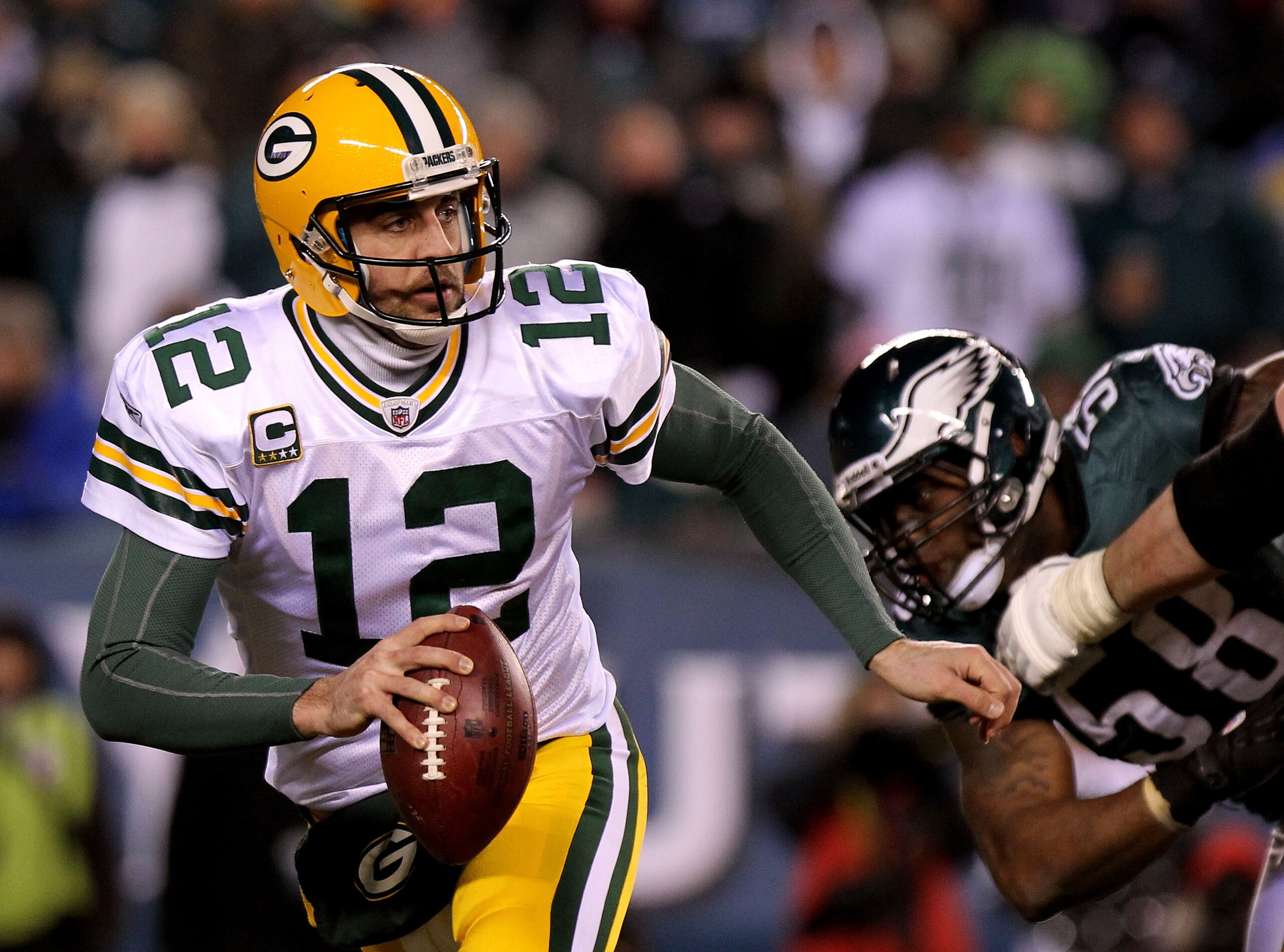 PHILADELPHIA, PA - JANUARY 09: Aaron Rodgers #12 of the Green Bay Packers scrambles against the Philadelphia Eagles during the 2011 NFC wild card playoff game at Lincoln Financial Field on January 9, 2011 in Philadelphia, Pennsylvania. (Photo by Nick La PHILADELPHIA, PA - JANUARY 09: Aaron Rodgers #12 of the Green Bay Packers scrambles against the Philadelphia Eagles during the 2011 NFC wild card playoff game at Lincoln Financial Field on January 9, 2011 in Philadelphia, Pennsylvania. (Photo by Nick La
