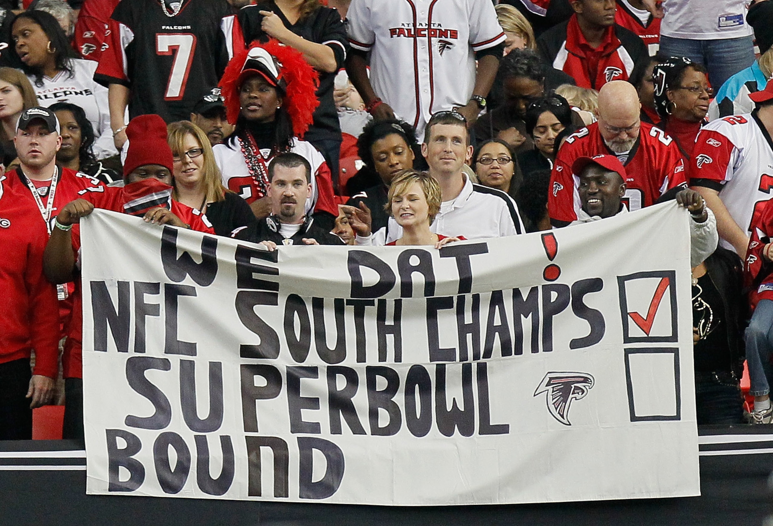 ATLANTA, GA - JANUARY 02:  Fans of the Atlanta Falcons hold up a sign with 'NFC South Champs' on it during the game against the Carolina Panthers at Georgia Dome on January 2, 2011 in Atlanta, Georgia.  (Photo by Kevin C. Cox/Getty Images)
