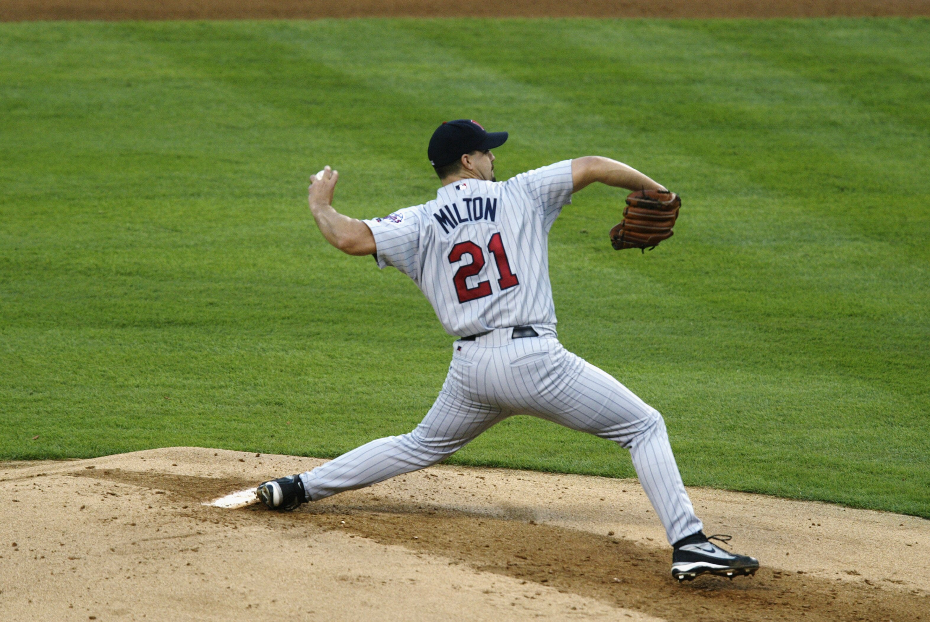 ANAHEIM, CA - OCTOBER 11:  Starting pitcher Eric Milton  #21 of the Minnesota Twins throws against the Anaheim Angels in game three of the American League Championship Series on October 11, 2002 at Edison International Field in Anaheim, California.  The A