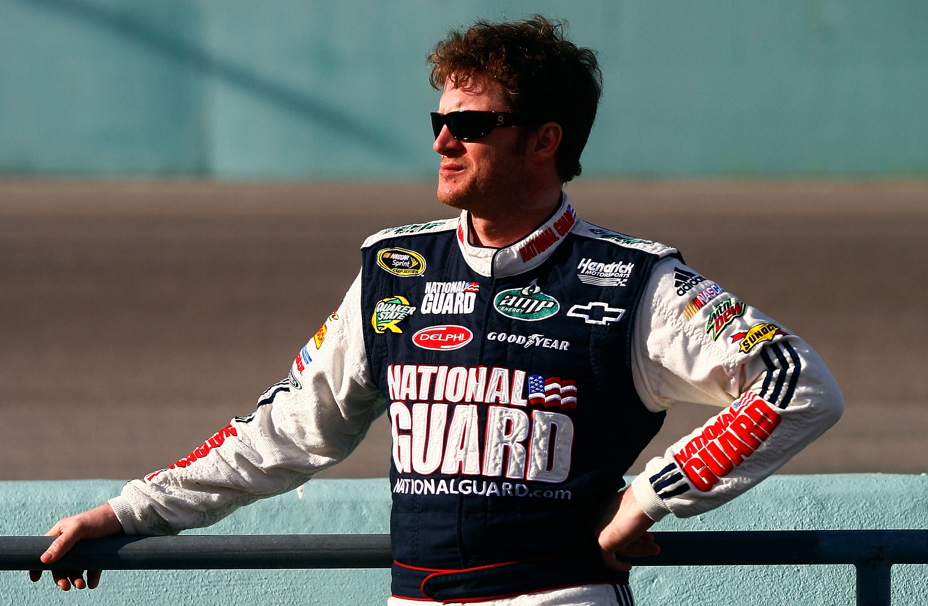 HOMESTEAD, FL - NOVEMBER 19:  Dale Earnhardt Jr., driver of the #88 National Guard/AMP Energy Chevrolet, stands on the grid during qualifying for the NASCAR Sprint Cup Series Ford 400 at Homestead-Miami Speedway on November 19, 2010 in Homestead, Florida.
