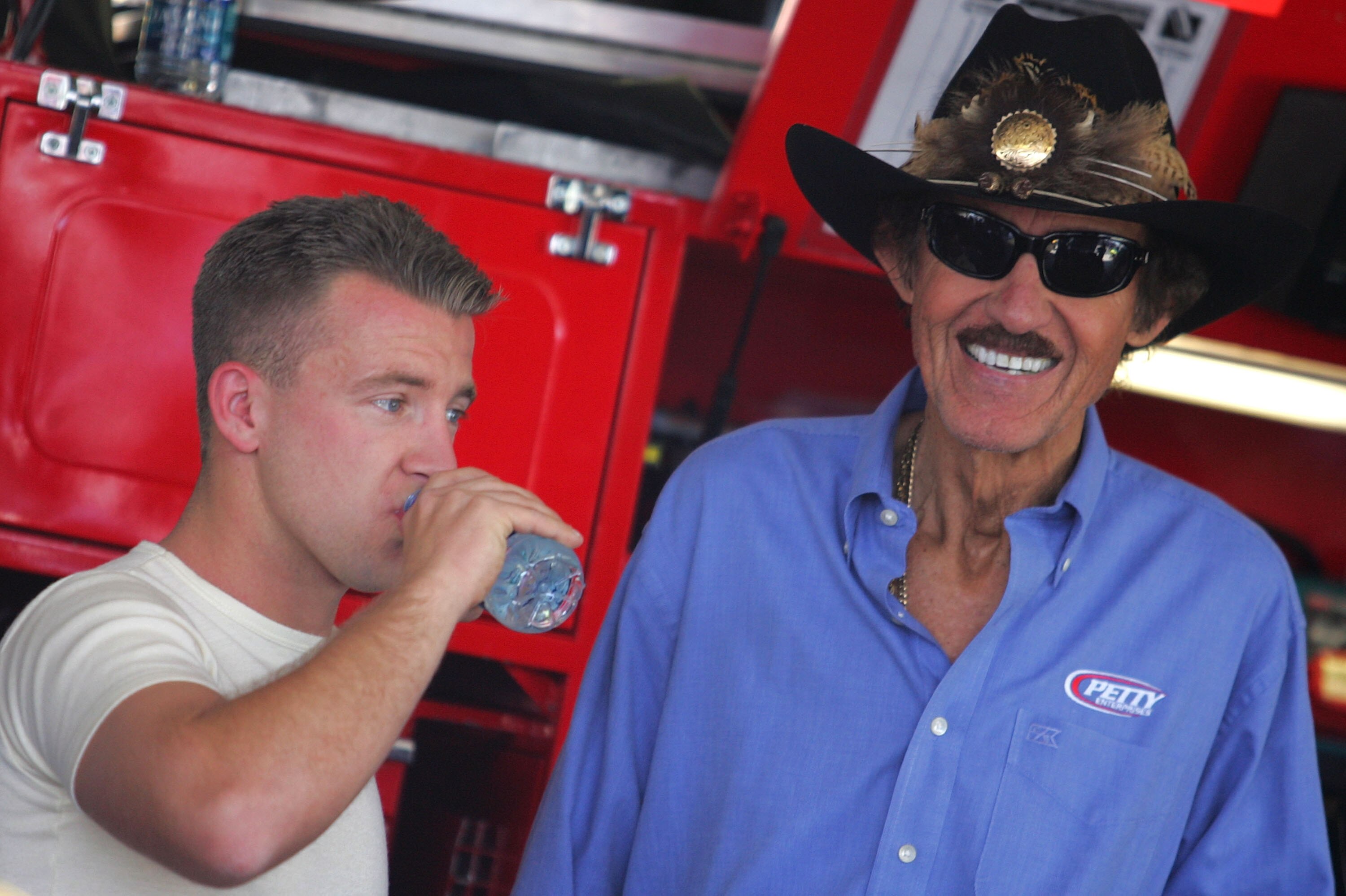 AVONDALE, AZ - APRIL 17:  AJ Allmendinger (L), driver of the #44 Charter Dodge, talks with team owner Richard Petty (R) during practice for the NASCAR Sprint Cup Series SUBWAY Fresh Fit 500 at Phoenix International Raceway on April 17, 2009 in Avondale, A