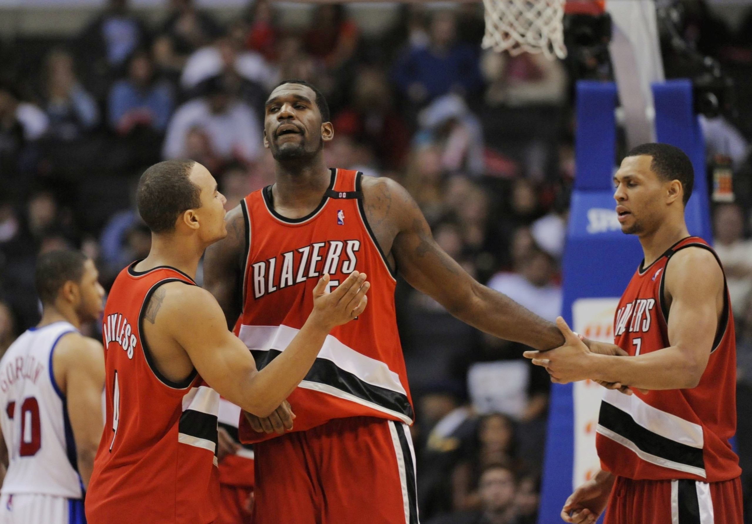 LOS ANGELES, CA - JANUARY 26: Greg Oden #52 of the Portland Trail Blazers celebrates with teammates Brandon Roy #7 and Jerryd Bayless #4 during their game against the Los Angeles Clippers at Staples Center January 26, 2009 in Los Angeles, California. NOTE