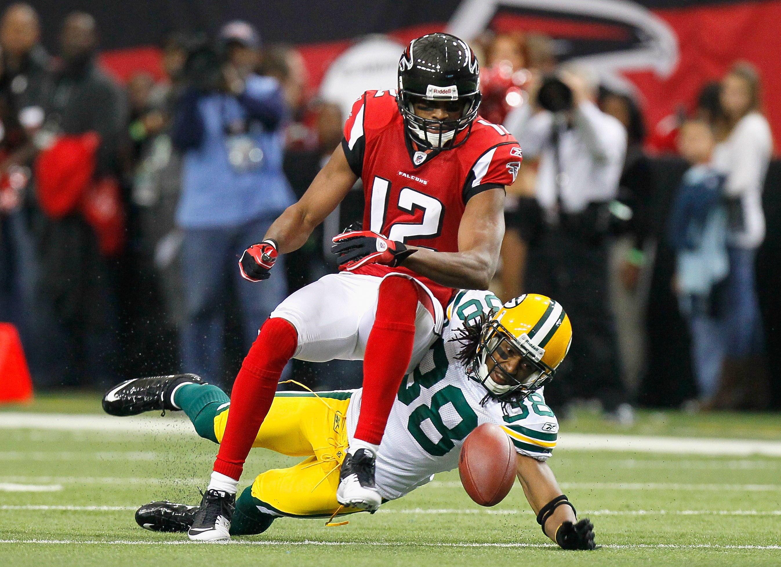 ATLANTA - NOVEMBER 28:  Tramon Williams #38 of the Green Bay Packers breaks up a pass intended for Michael Jenkins #12 of the Atlanta Falcons at Georgia Dome on November 28, 2010 in Atlanta, Georgia.  (Photo by Kevin C. Cox/Getty Images)