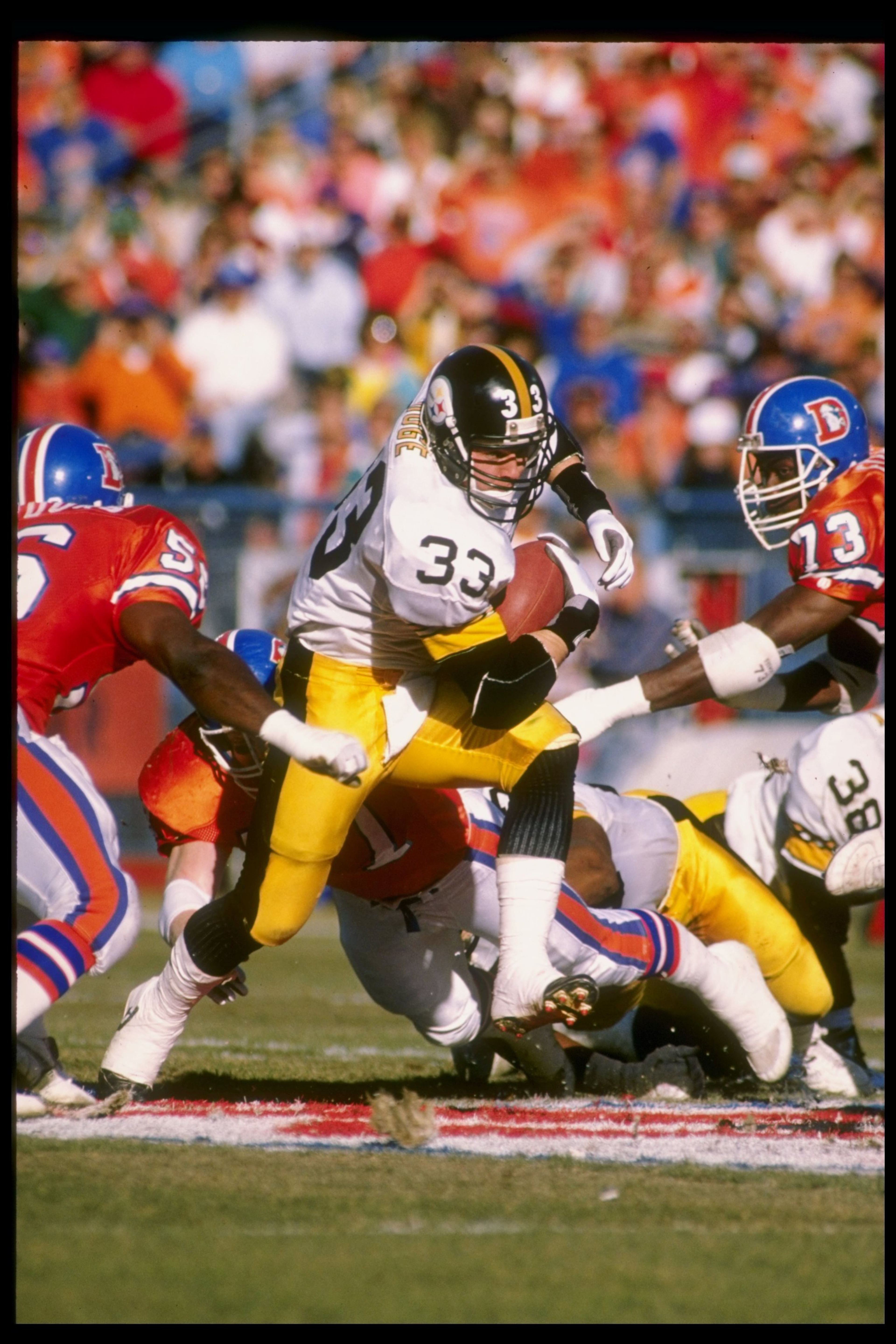 7 Jan 1990: Fullback Merrill Hoge of the Pittsburgh Steelers runs with the ball during a game against the Denver Broncos at Mile High Stadium in Denver, Colorado. The Broncos won the game 24-23. Mandatory Credit: Tim de Frisco /Allsport 7 Jan 1990: Fullback Merrill Hoge of the Pittsburgh Steelers runs with the ball during a game against the Denver Broncos at Mile High Stadium in Denver, Colorado. The Broncos won the game 24-23. Mandatory Credit: Tim de Frisco /Allsport