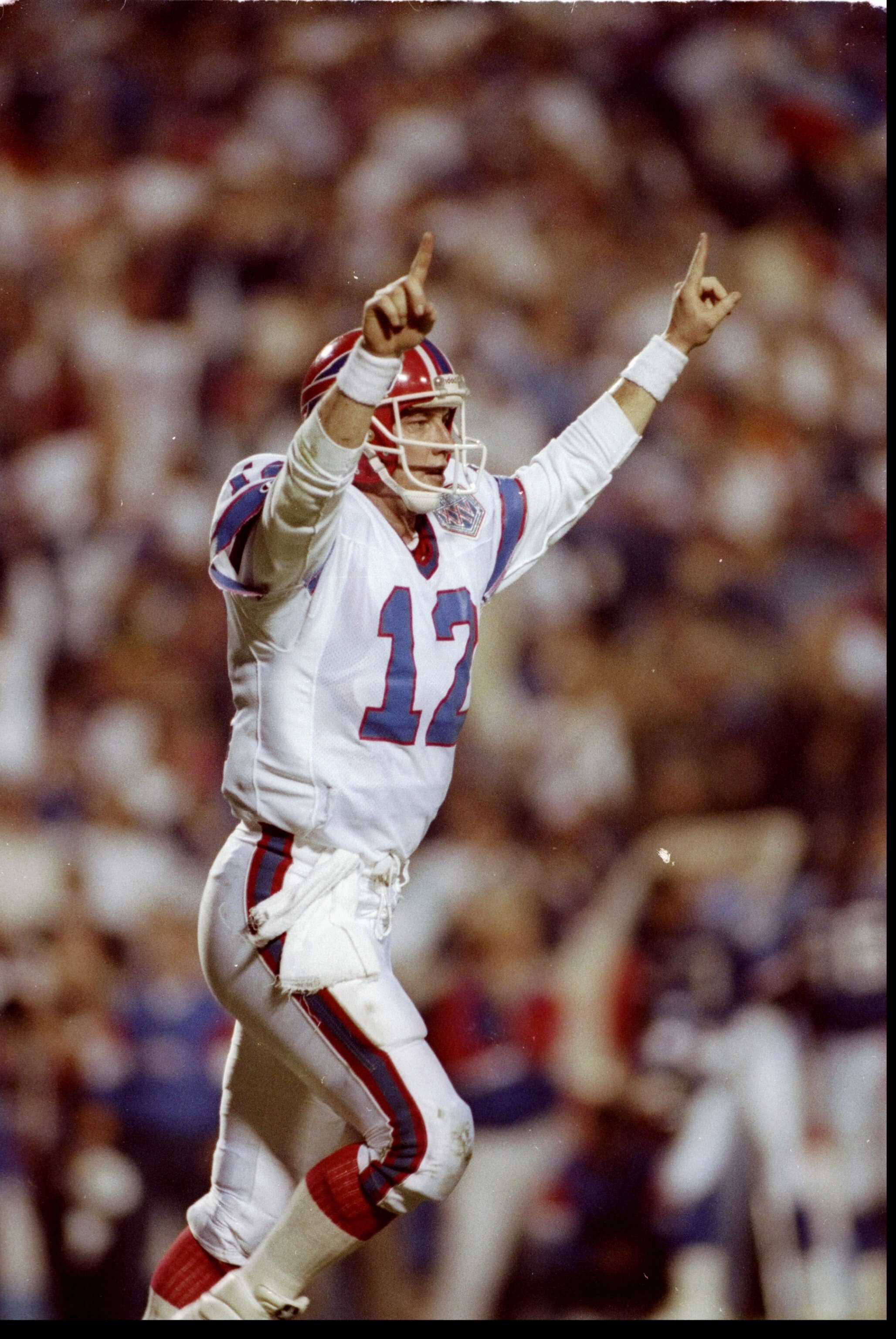 27 Jan 1991: Quarterback Jim Kelly of the Buffalo Bills celebrates during Super Bowl XXV against the New York Giants at Tampa Stadium in Tampa, Florida. The Giants won the game, 20-19.