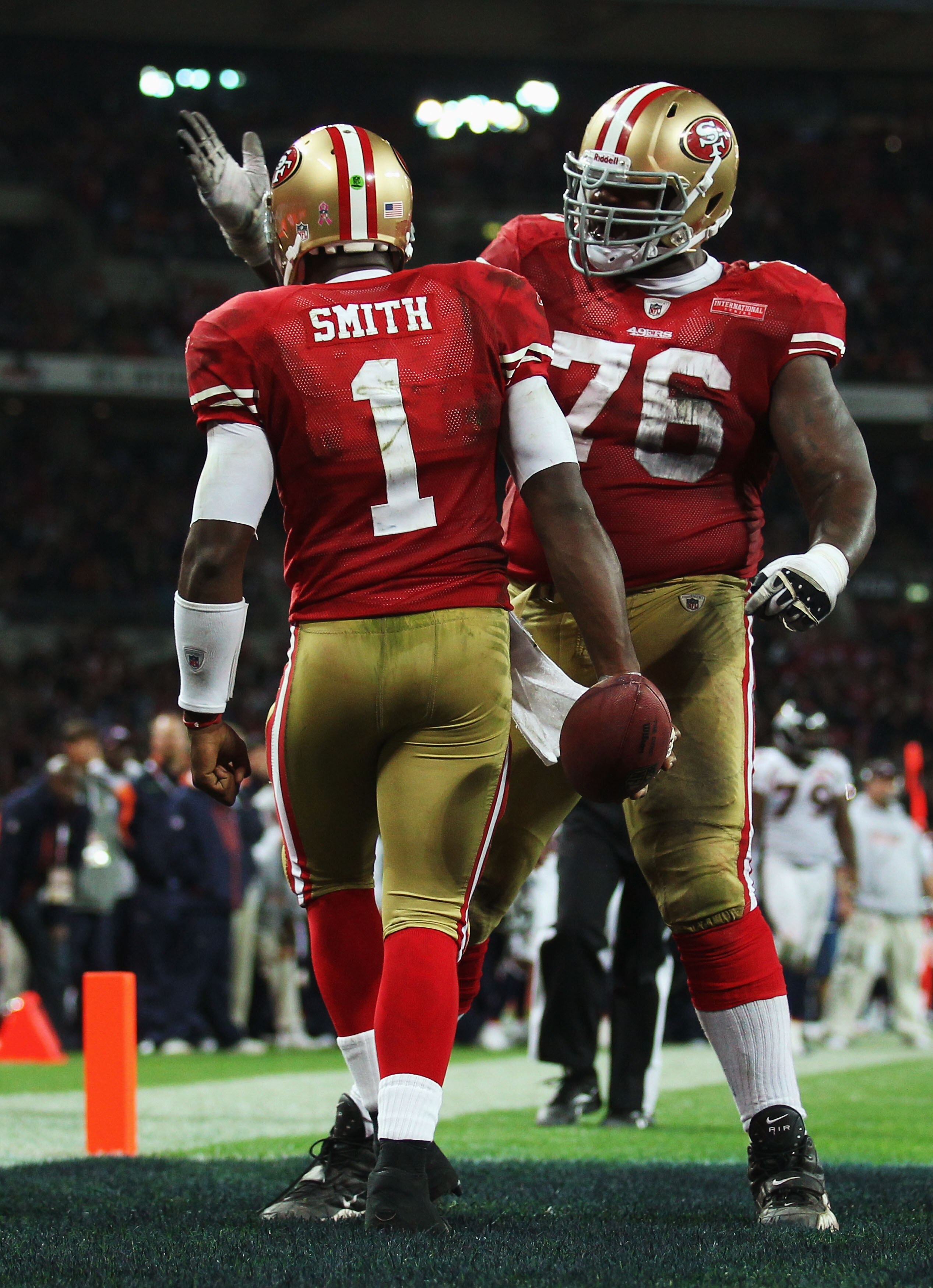 LONDON, ENGLAND - OCTOBER 31:  Troy Smith #1 of San Francisco 49ers is congratulated by Anthony Davis #76 scores their first touchdown during the NFL International Series match between Denver Broncos and San Francisco 49ers at Wembley Stadium on October 3