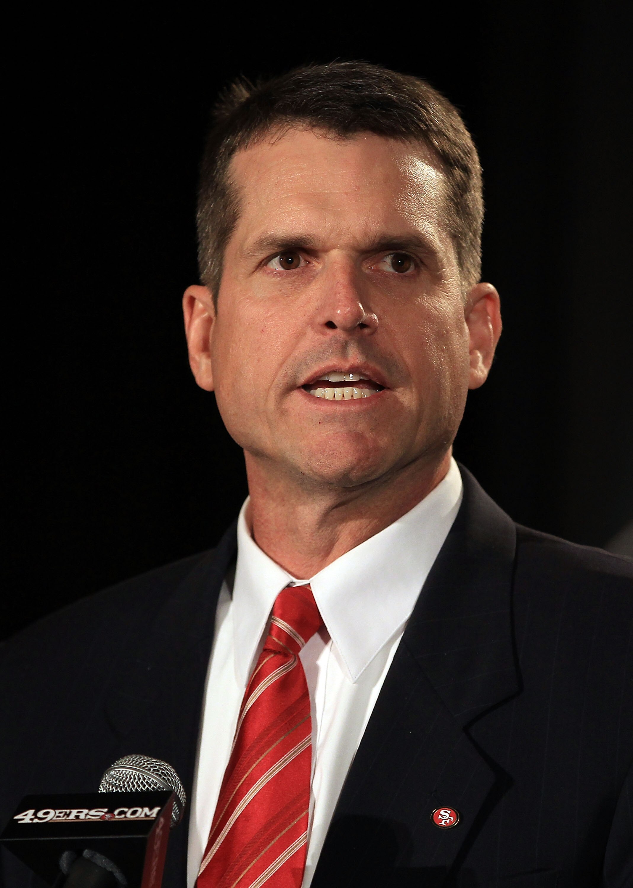 SAN FRANCISCO, CA - JANUARY 07:  Jim Harbaugh speaks at a press conference where he was introduced as the new San Francisco 49ers head coach at the Palace Hotel on January 7, 2011 in San Francisco, California.  (Photo by Ezra Shaw/Getty Images)