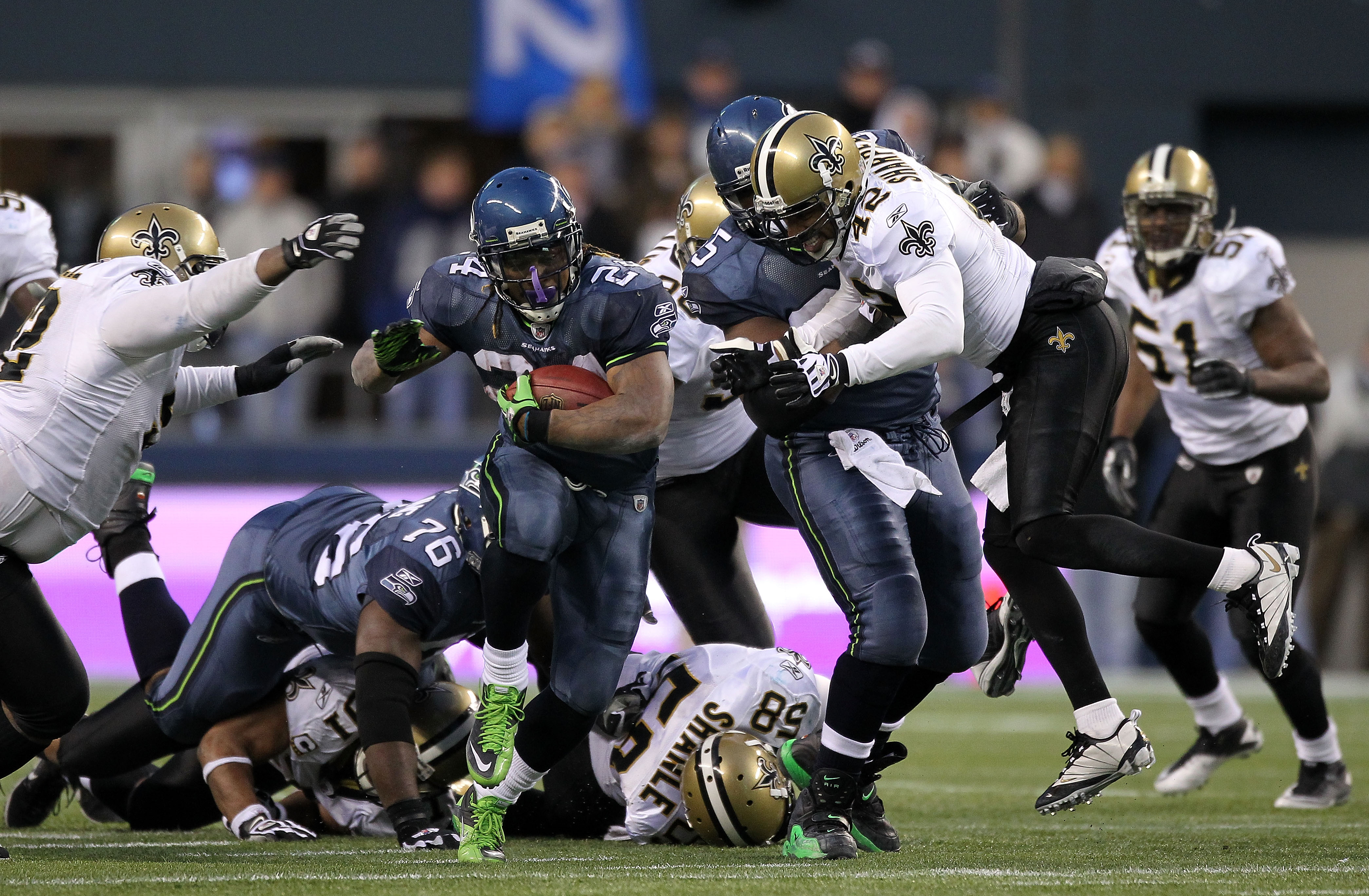 SEATTLE, WA - JANUARY 08:  Running back Marshawn Lynch #24 of the Seattle Seahawks runs for a 67-yard touchdown run in the fourth quarter against the New Orleans Saints during the 2011 NFC wild-card playoff game at Qwest Field on January 8, 2011 in Seattl