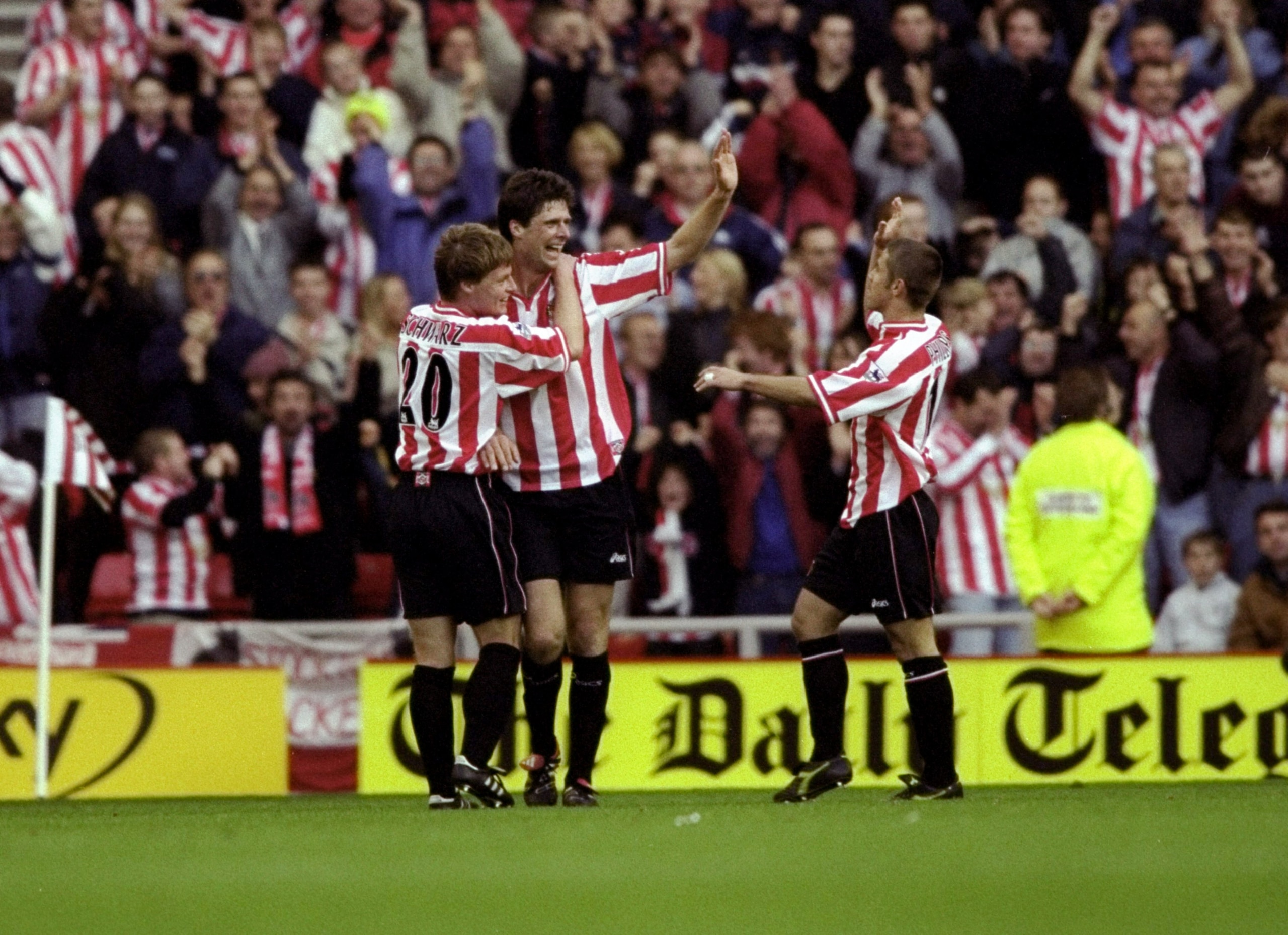 31 Oct 1999: Niall Quinn of Sunderland celebrates his goal against Tottenham Hotspur with team mates Stefan Schwarz and Kevin Phillips during the FA Carling Premiership match at the Stadium of Light in Sunderland, England. Sunderland won 2-1. \ Mandatory 31 Oct 1999: Niall Quinn of Sunderland celebrates his goal against Tottenham Hotspur with team mates Stefan Schwarz and Kevin Phillips during the FA Carling Premiership match at the Stadium of Light in Sunderland, England. Sunderland won 2-1. \ Mandatory