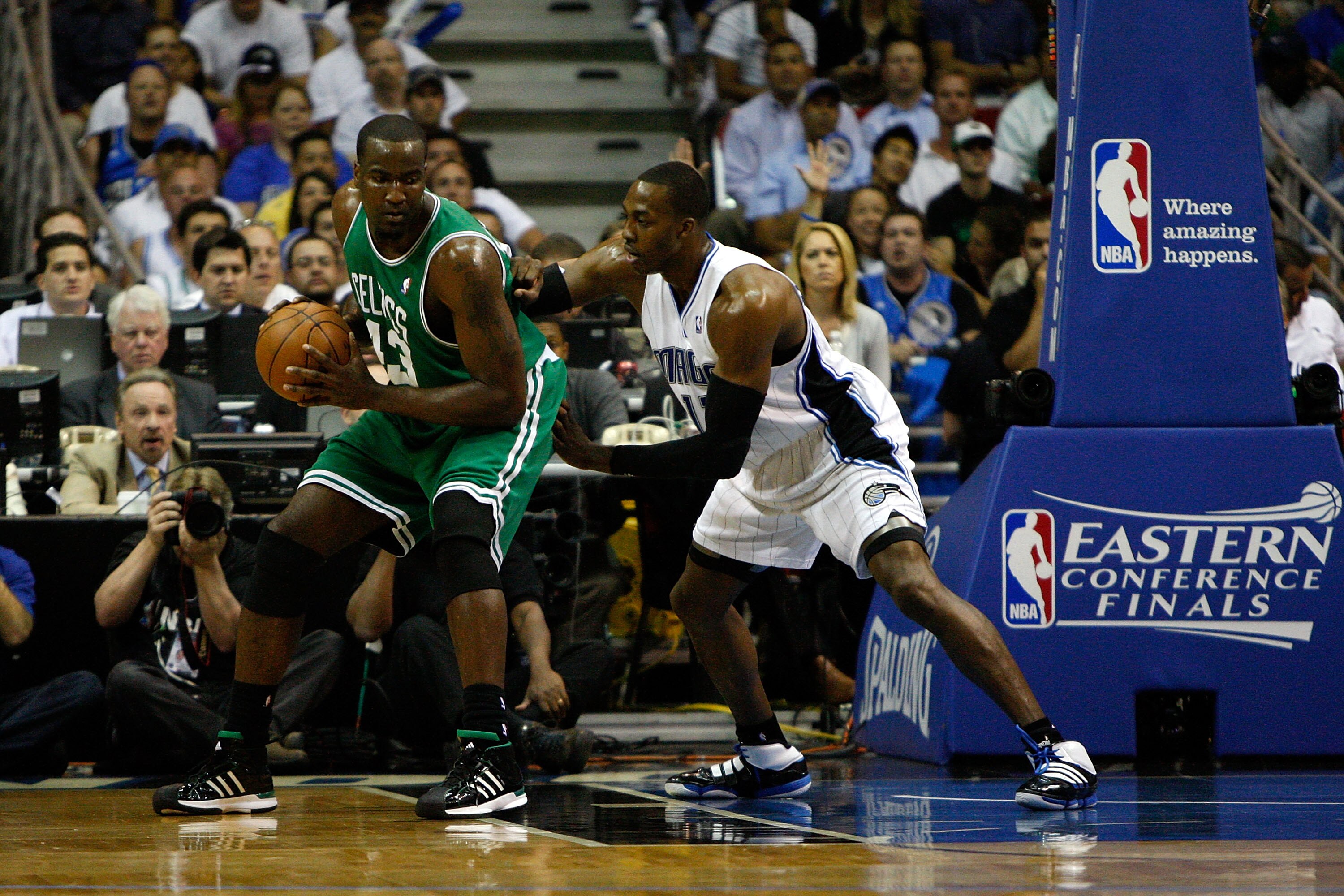 ORLANDO, FL - MAY 26:  Kendrick Perkins #43 of the Boston Celtics sets up in the post against Dwight Howard #12 of the Orlando Magic in Game Five of the Eastern Conference Finals during the 2010 NBA Playoffs at Amway Arena on May 26, 2010 in Orlando, Flor