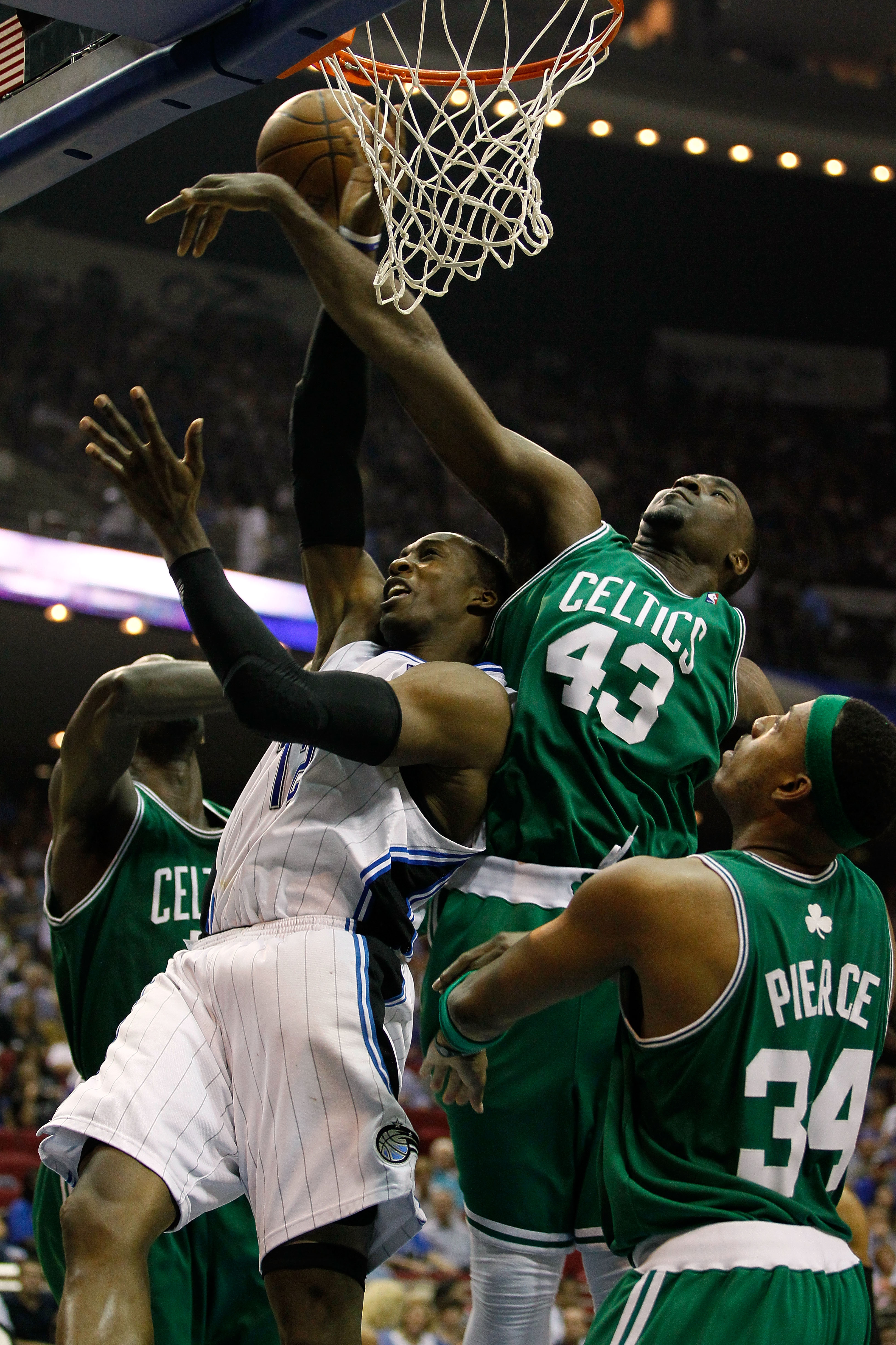 ORLANDO, FL - MAY 18:  Dwight Howard #12 of the Orlando Magic draws contact as he attempts a shot against Kendrick Perkins #43 and Paul Pierce #34 of the Boston Celtics in Game Two of the Eastern Conference Finals during the 2010 NBA Playoffs at Amway Are
