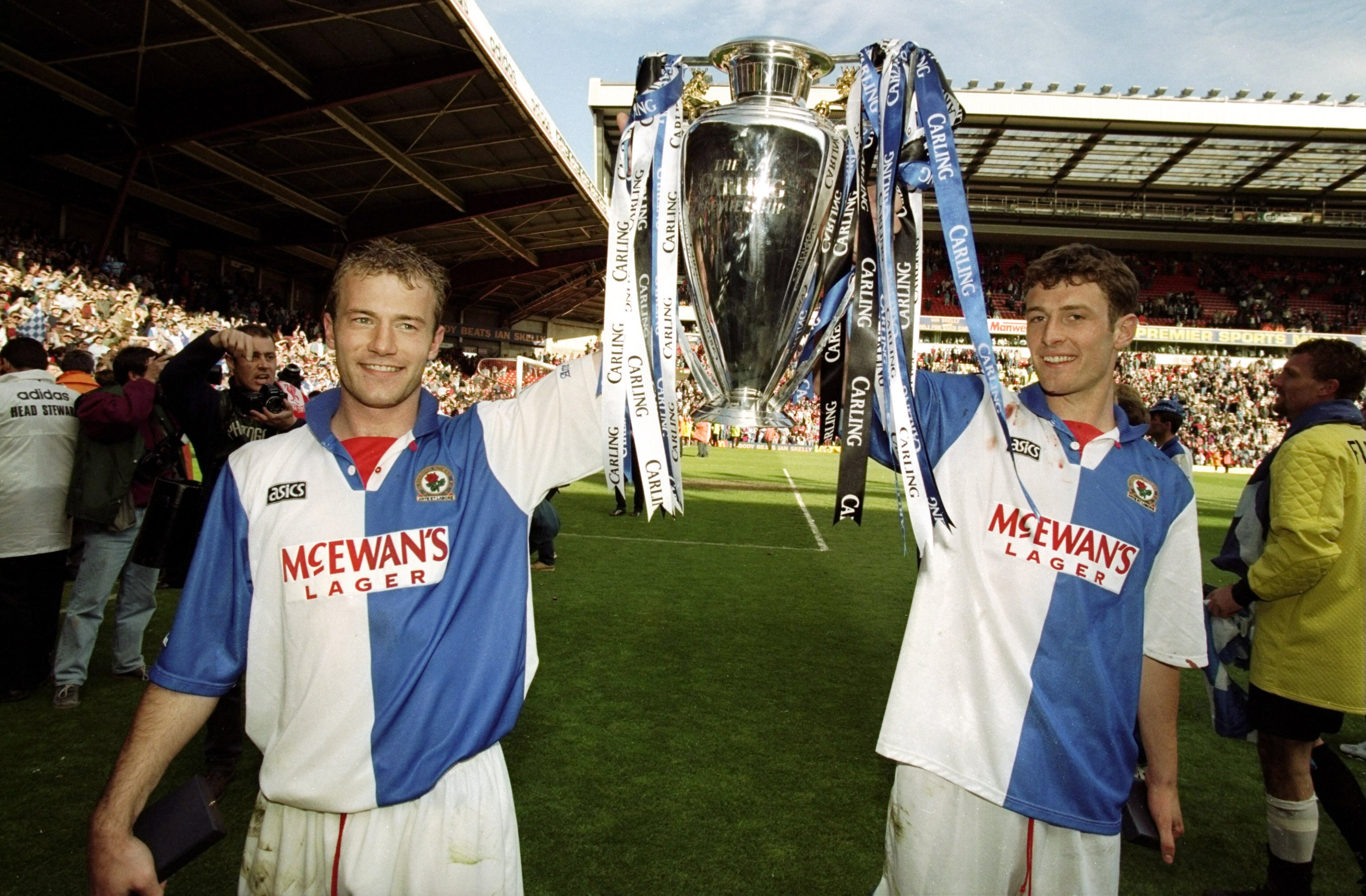 14 May 1998:  Alan Shearer and Chris Sutton of Blackburn Rovers celebrate with the Premiership trophy after winning the Premiership title during the FA Carling Premiership match against Liverpool played at Anfield in Liverpool, England.  The match finishe