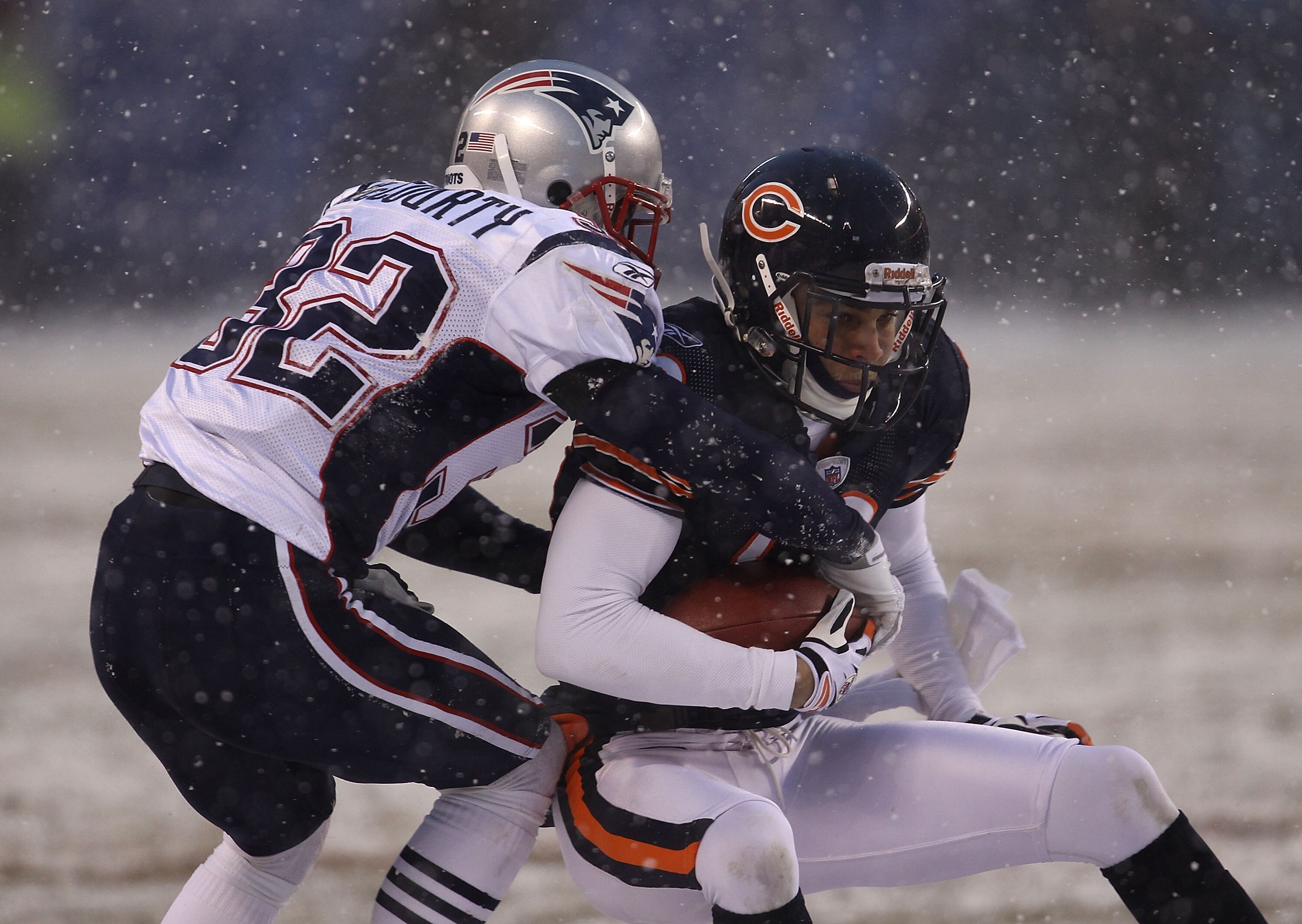 CHICAGO, IL - DECEMBER 12: Johnny Knox #13 of the Chicago Bears is hit by Devin McCourty #32 of the New England Patriots at Soldier Field on December 12, 2010 in Chicago, Illinois. The Patriots defeated the Bears 36-7. (Photo by Jonathan Daniel/Getty Imag