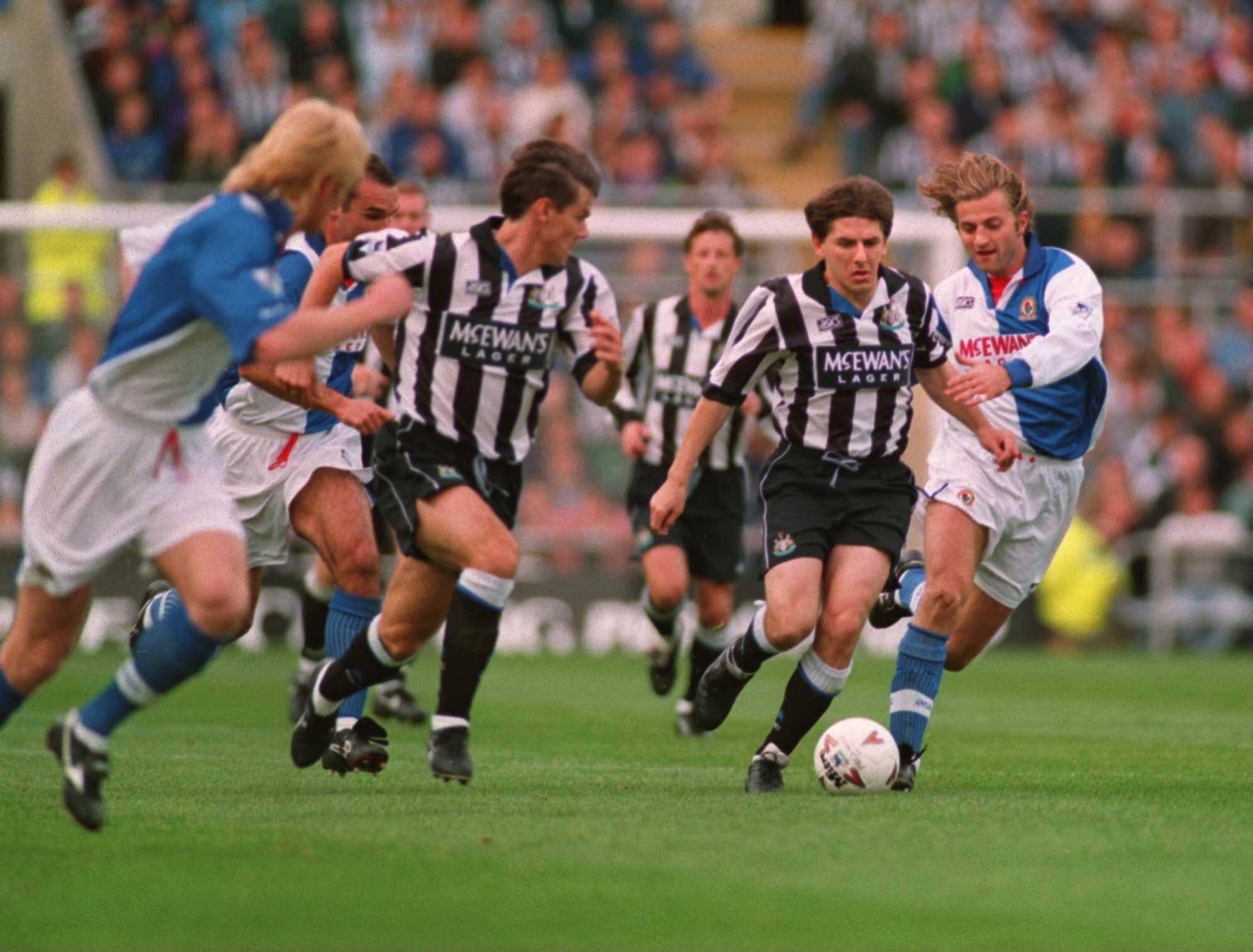9 OCT 1994:  NEWCASTLE's PETER BEARDSLEY RUNS THROUGH THE MIDDLE OF THE BLACKBURN DEFENCE DURING THE NEWCASTLE UNITED V BLACKBURN ROVERS IN THE FA PREMIERSHIP AT ST. JAMES PARK, NEWCASTLE. Mandatory Credit: Clive Brunskill/ALLSPORT