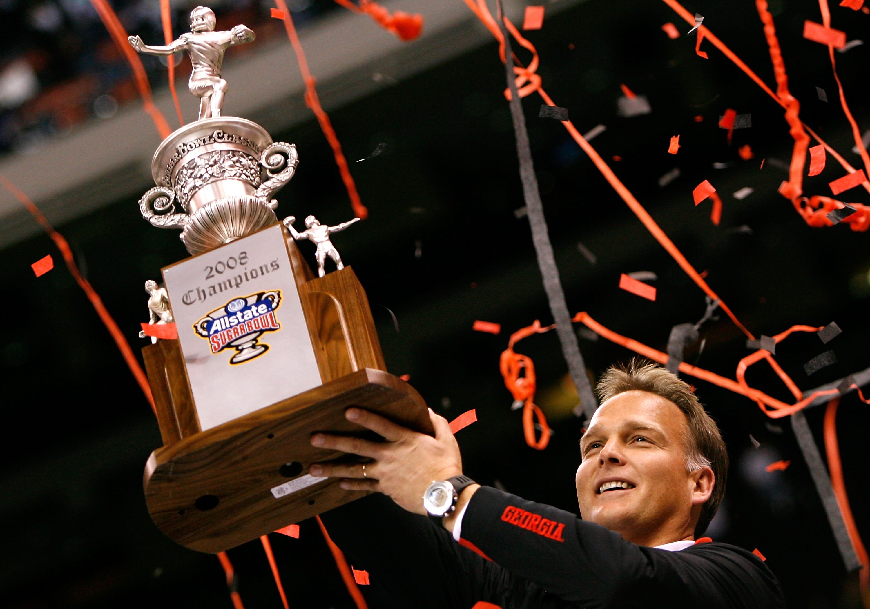 NEW ORLEANS - JANUARY 01:  Head coach Mark Richt of the Georgia Bulldogs celebrates with the trophy after their 41-10 win against the Hawai'i Warriors during the Allstate Sugar Bowl at the Louisiana Superdome on January 1, 2008 in New Orleans, Louisiana. 