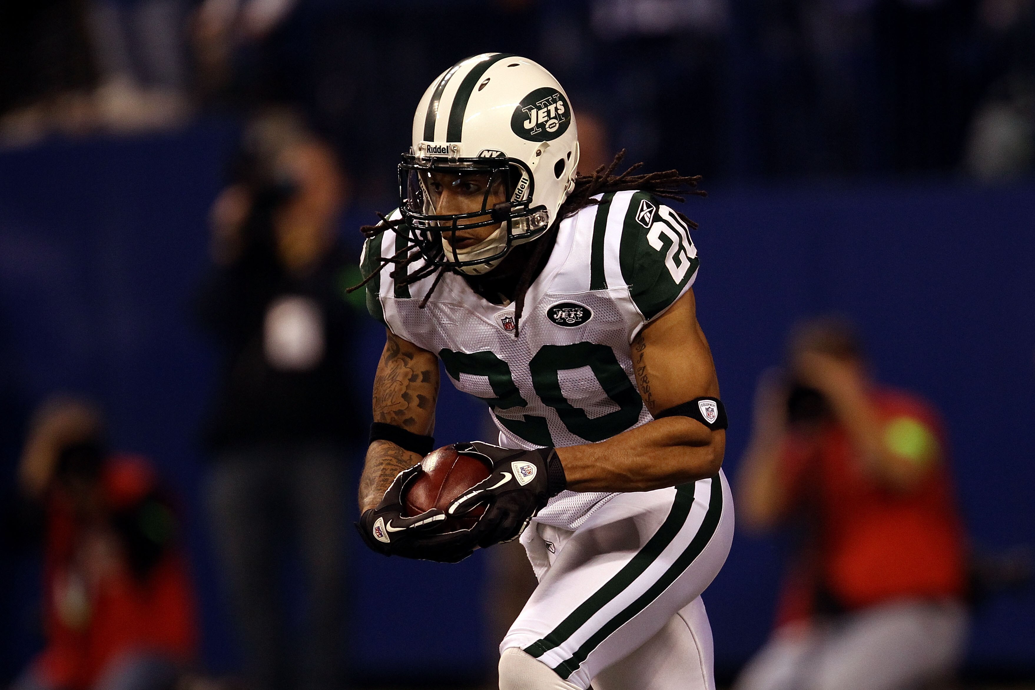 INDIANAPOLIS, IN - JANUARY 08:  Kyle Wilson #20 of the New York Jets returns a kickoff against the Indianapolis Colts during their 2011 AFC wild card playoff game at Lucas Oil Stadium on January 8, 2011 in Indianapolis, Indiana. The Jets won 17-16.  (Phot