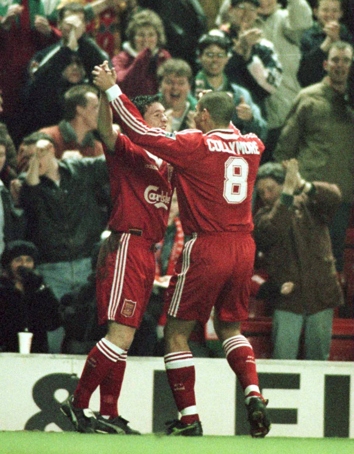 28 Feb 1996: Stan Collymore of Liverpool celebrates with first goal scorer Robbie Fowler during Liverpool v Charlton Athletic in the FA cup fifth round at Anfield.