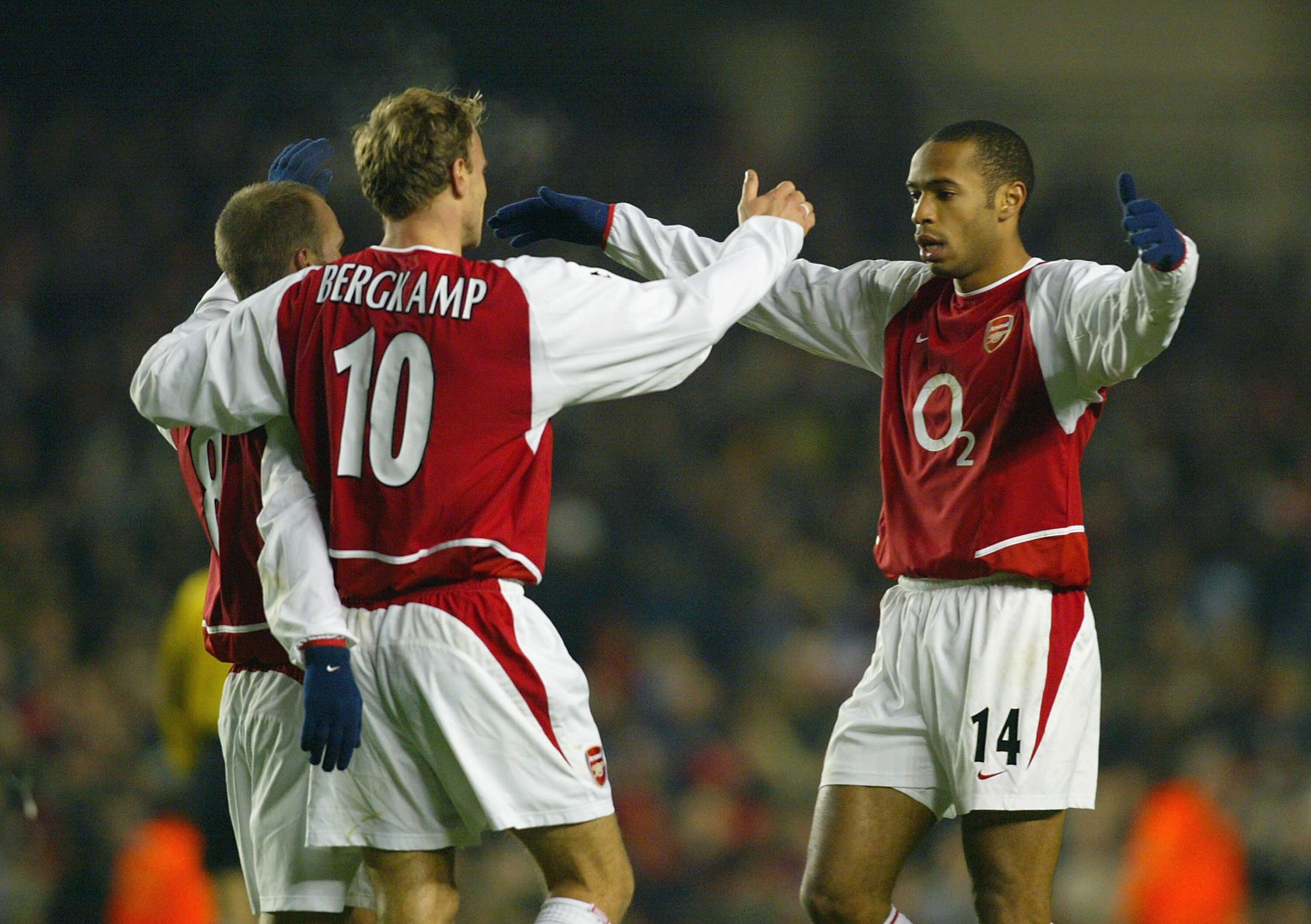 LONDON - DECEMBER 10:  Thierry Henry of Arsenal celebrates with Dennis Bergkamp and  Fredrik Ljungberg after Fredrik Ljungberg scored the second goal for Arsenal during the UEFA Champions League Group B match between Arsenal and Lokomotiv Moscow at Highbu