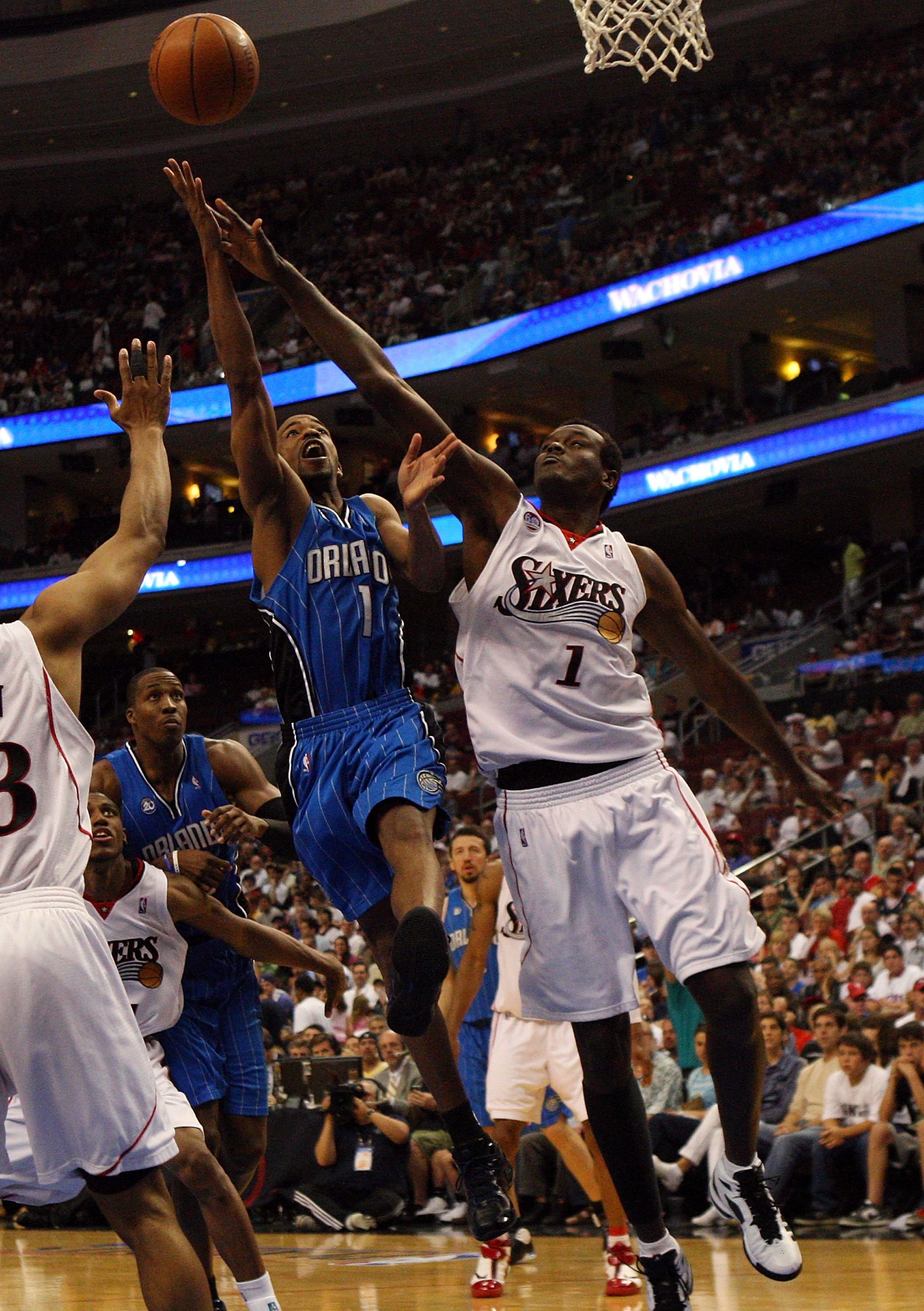 PHILADELPHIA - APRIL 26:  Rafer Alston #1 of the Orlando Magic drives to the hoop against Samuel Dalembert #1 of the Philadelphia 76ers during Game Four of the Eastern Conference Quarterfinals during the 2009 NBA Playoffs at the Wachovia Center on April 2