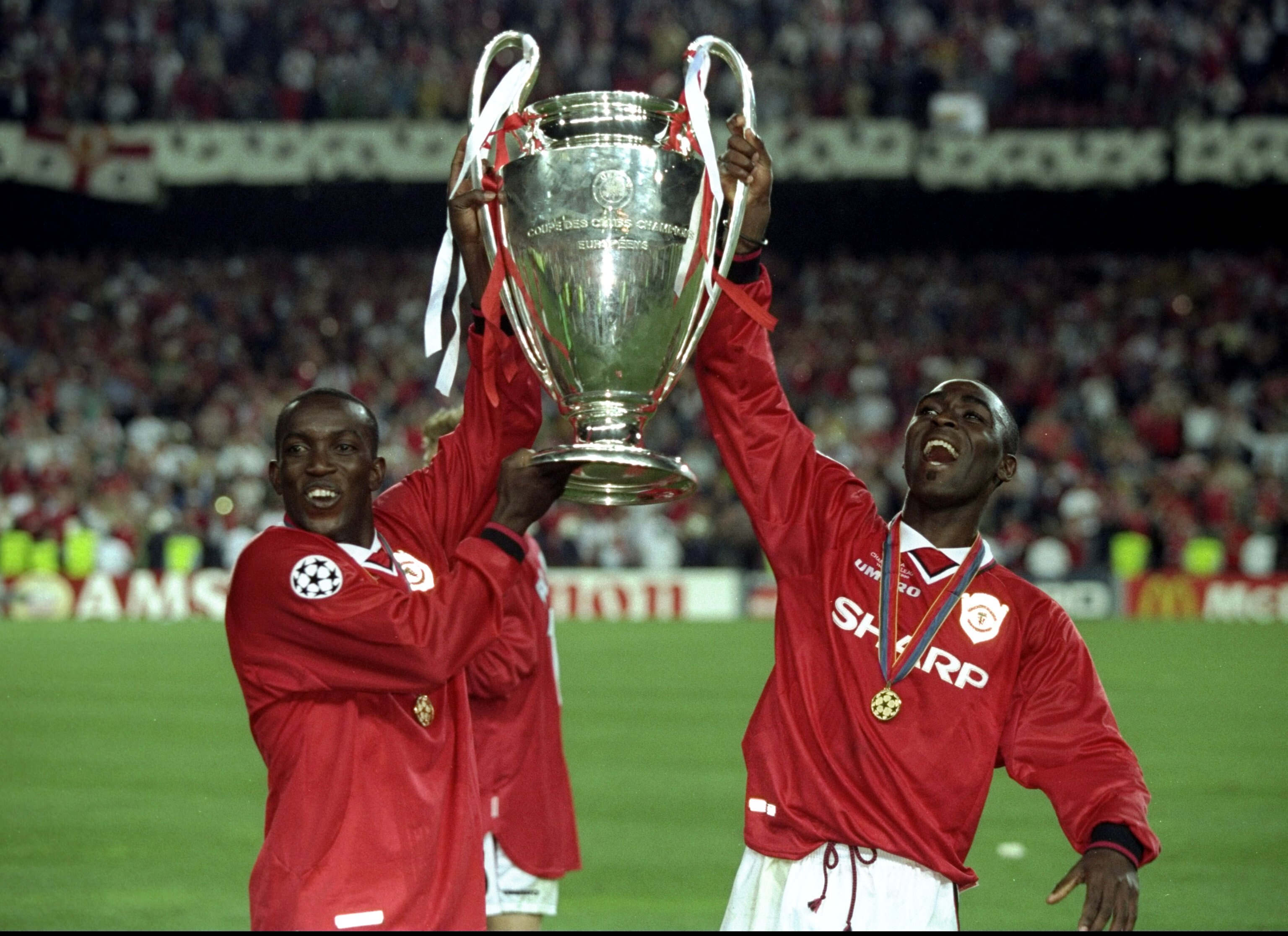 26 May 1999:  Dwight Yorke and Andy Cole of Manchester United lift the trophy after a 2-1 victory over Bayern Munich in the UEFA Champions League Final at the Nou Camp in Barcelona, Spain.  \ Mandatory Credit: Alex Livesey /Allsport