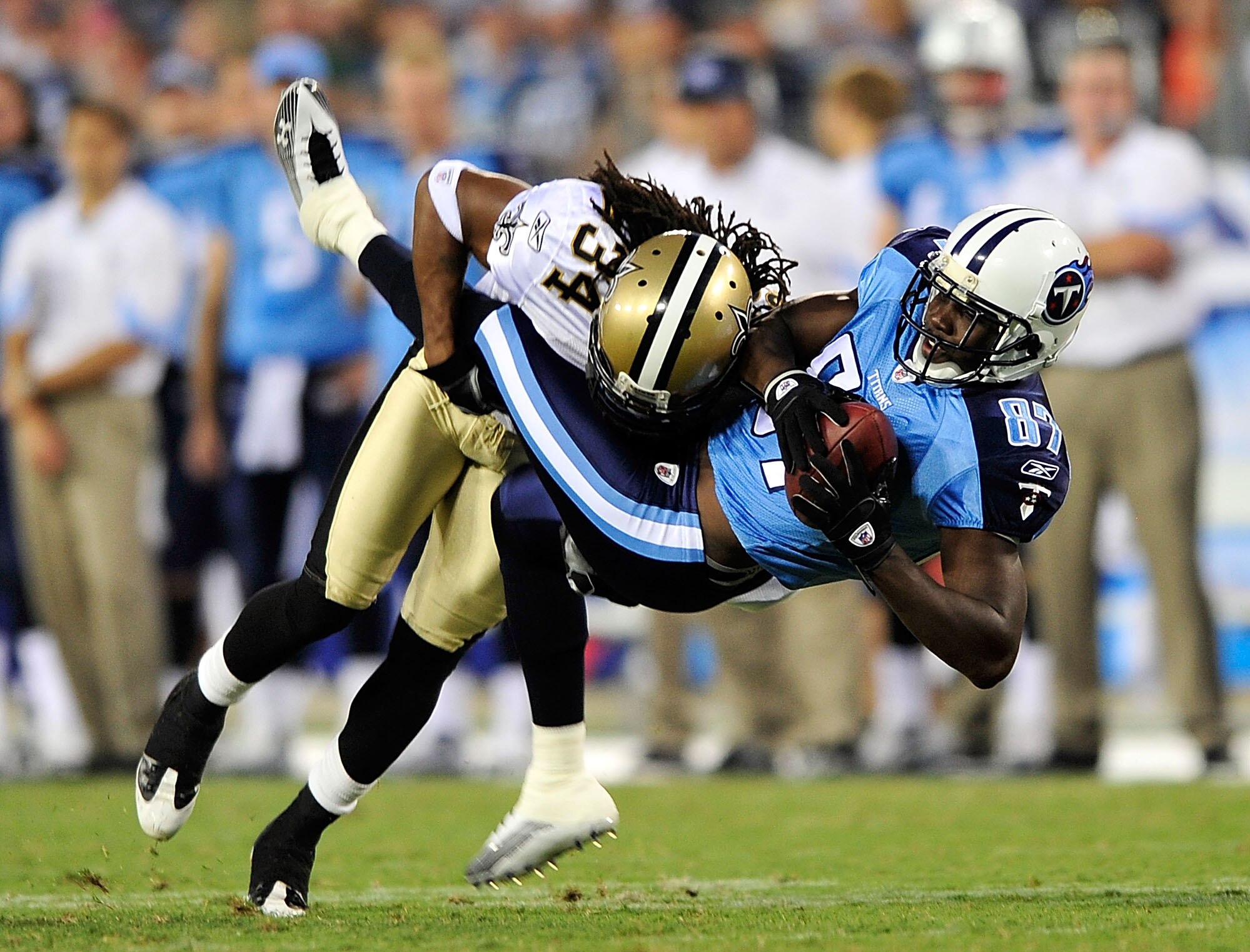 NASHVILLE, TN - SEPTEMBER 02:  Patrick Robinson #34 of the New Orleans Saints makes the hit on Lavelle Hawkins #87 of the Tennessee Titans after a 5-yard gain during the first half of an exhibition game at LP Field on September 2, 2010 in Nashville, Tenne