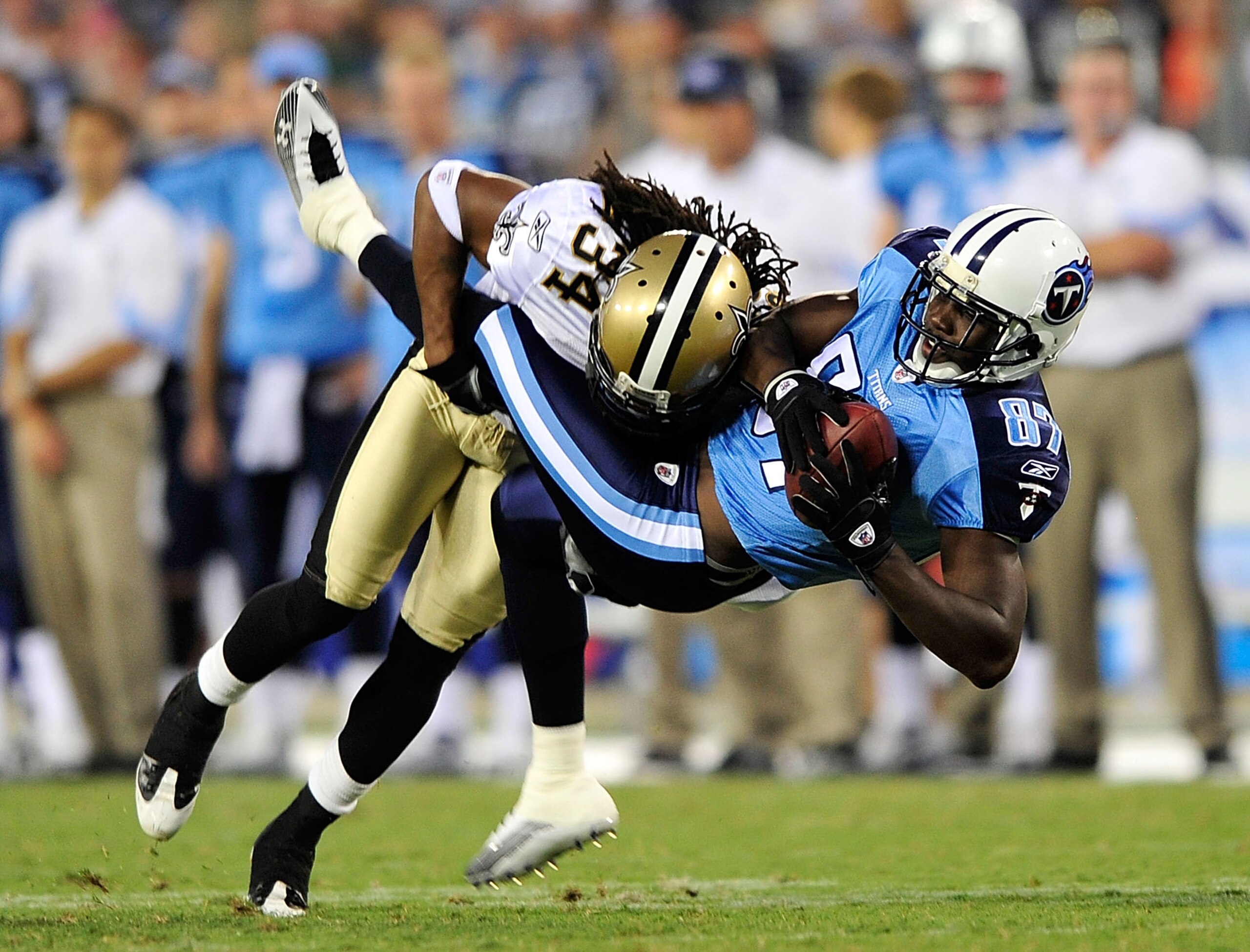 NASHVILLE, TN - SEPTEMBER 02:  Patrick Robinson #34 of the New Orleans Saints makes the hit on Lavelle Hawkins #87 of the Tennessee Titans after a 5-yard gain during the first half of an exhibition game at LP Field on September 2, 2010 in Nashville, Tenne