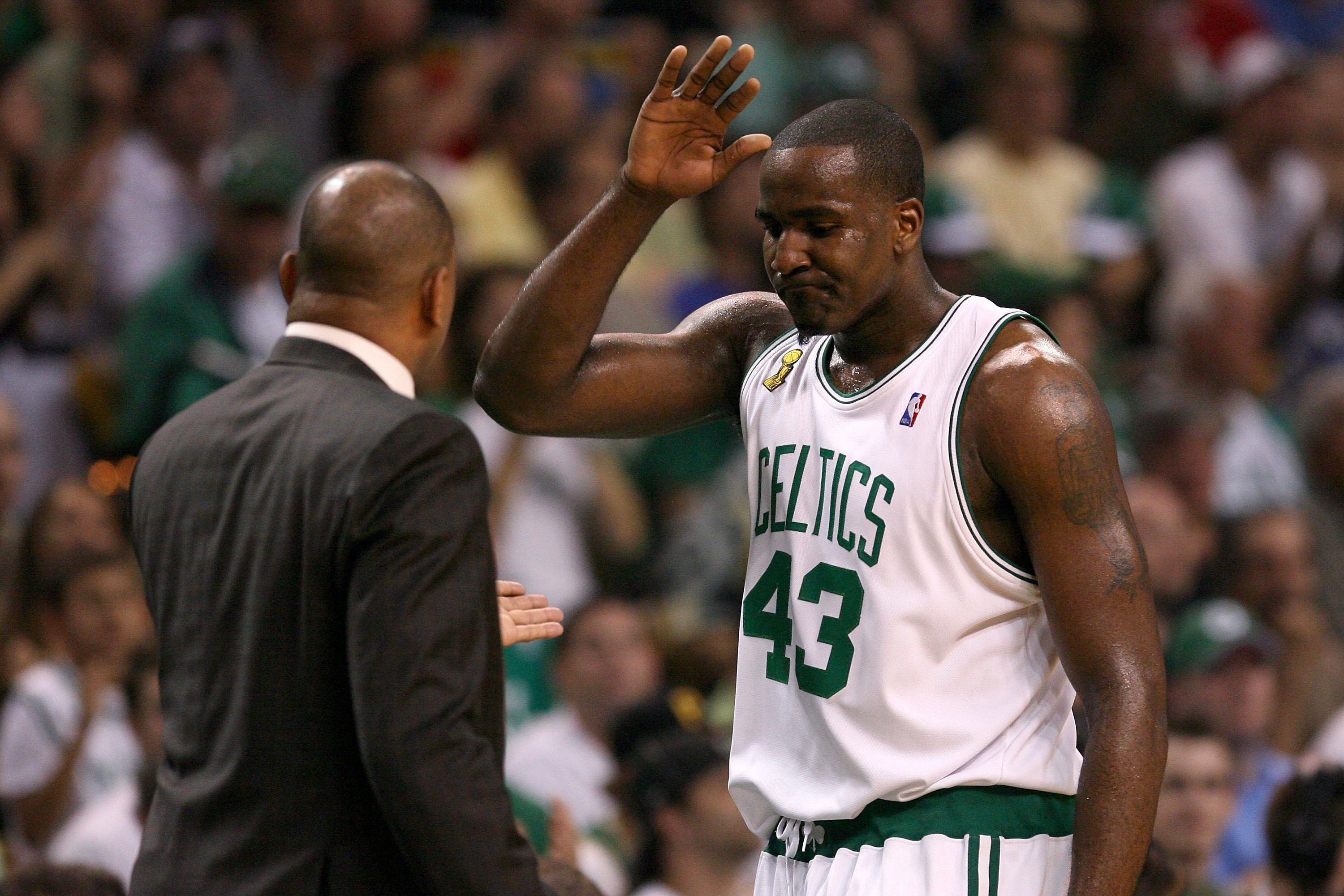BOSTON - JUNE 08:  Head coach Doc Rivers high fives Kendrick Perkins #43 of the Boston Celtics on the sideline in Game Two of the 2008 NBA Finals against the Los Angeles Lakers on June 8, 2008 at TD Banknorth Garden in Boston, Massachusetts.  The Celtics
