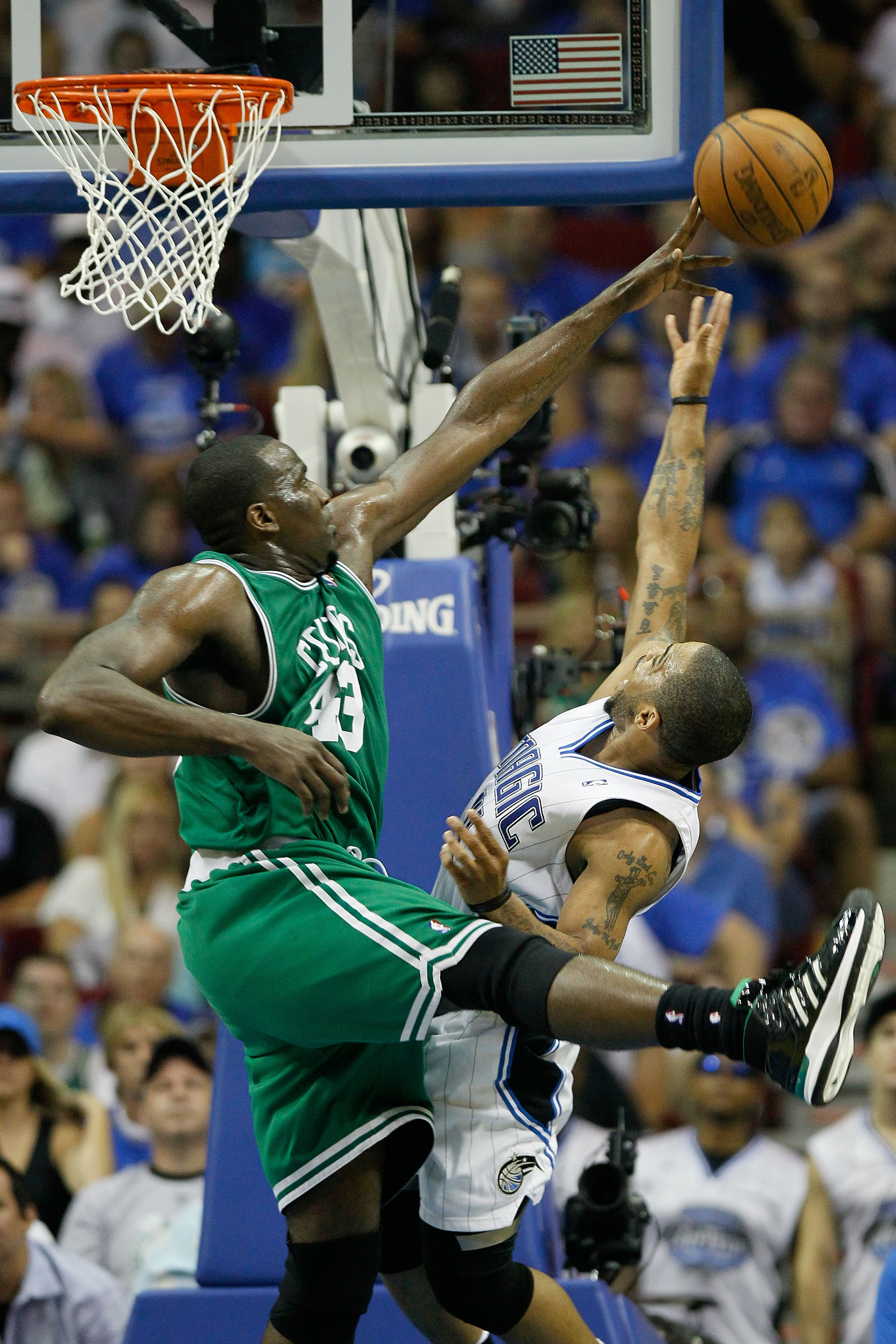 ORLANDO, FL - MAY 16:  Kendrick Perkins #43 of the Boston Celtics blocks a shot attempt by Jameer Nelson #14 of the Orlando Magic in Game One of the Eastern Conference Finals during the 2010 NBA Playoffs at Amway Arena on May 16, 2010 in Orlando, Florida.