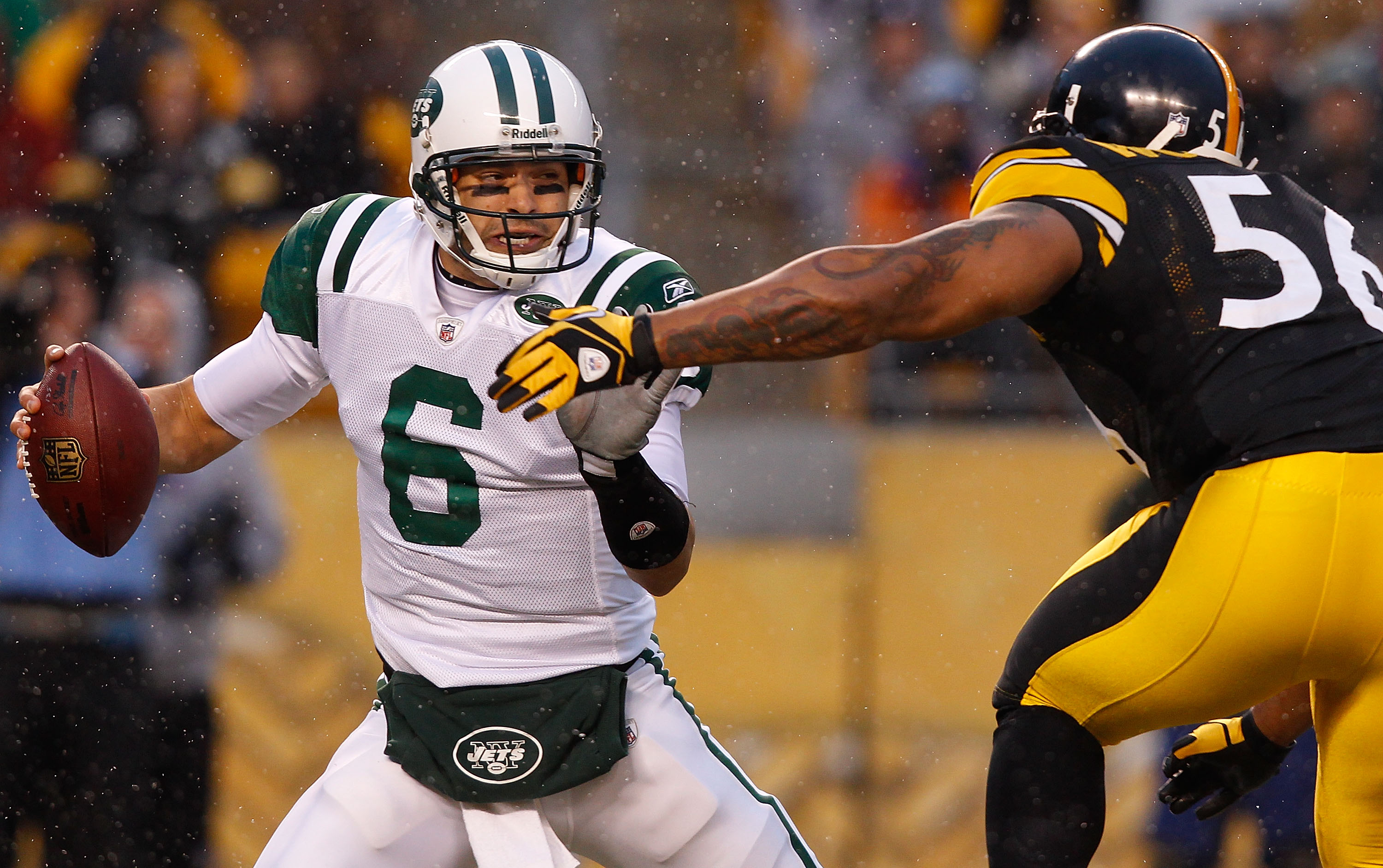 PITTSBURGH - DECEMBER 19:  Mark Sanchez #6 of the New York Jets is rushed by LaMarr Woodley #56 of the Pittsburgh Steelers during the game on December 19, 2010 at Heinz Field in Pittsburgh, Pennsylvania.  (Photo by Jared Wickerham/Getty Images)