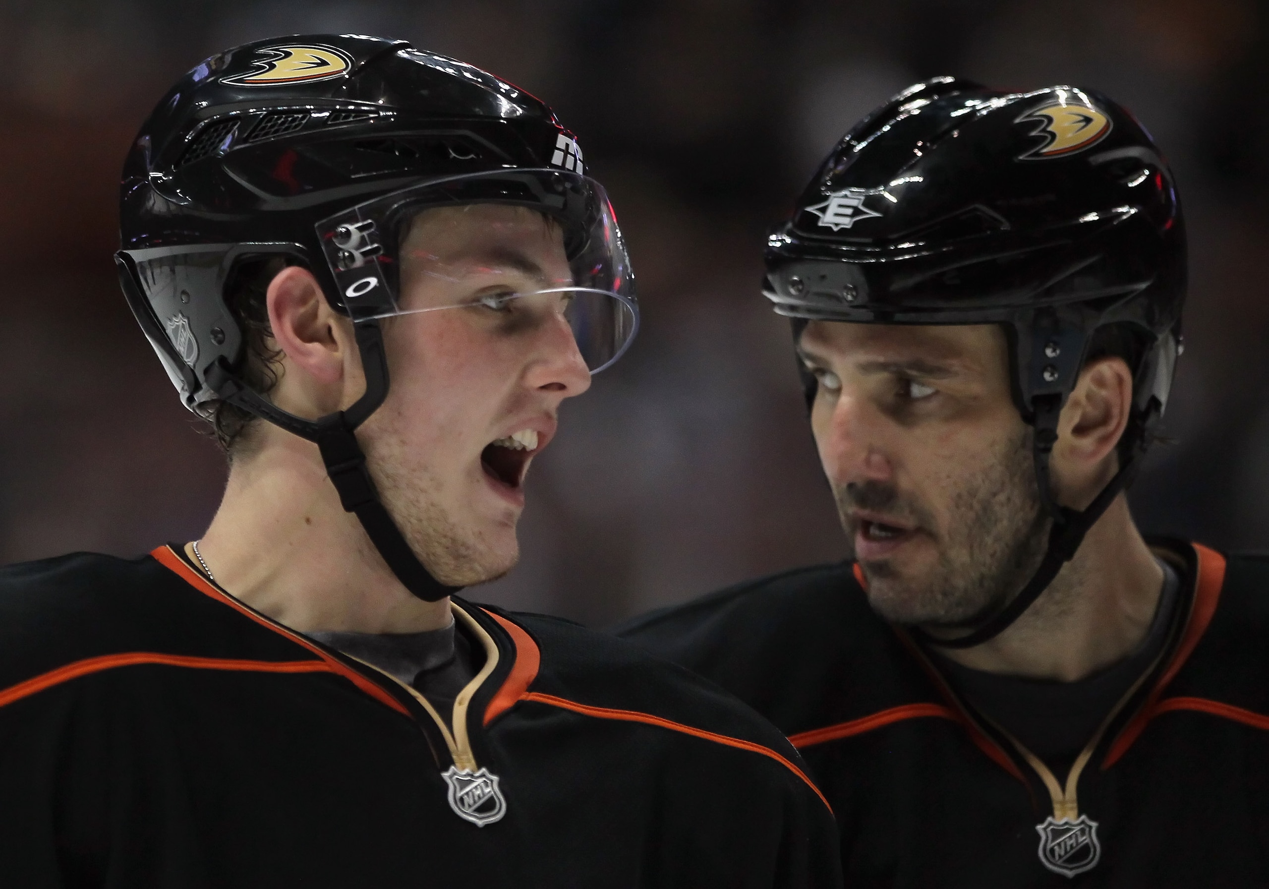 ANAHEIM, CA - JANUARY 07:  Cam Fowler (L) #4 and Andreas Lilja #3 of the Anaheim Ducks converse in the third period against the Columbus Blue Jackets at the Honda Center on January 7, 2011 in Anaheim, California. The Ducks defeated the Blue Jackets 6-0.