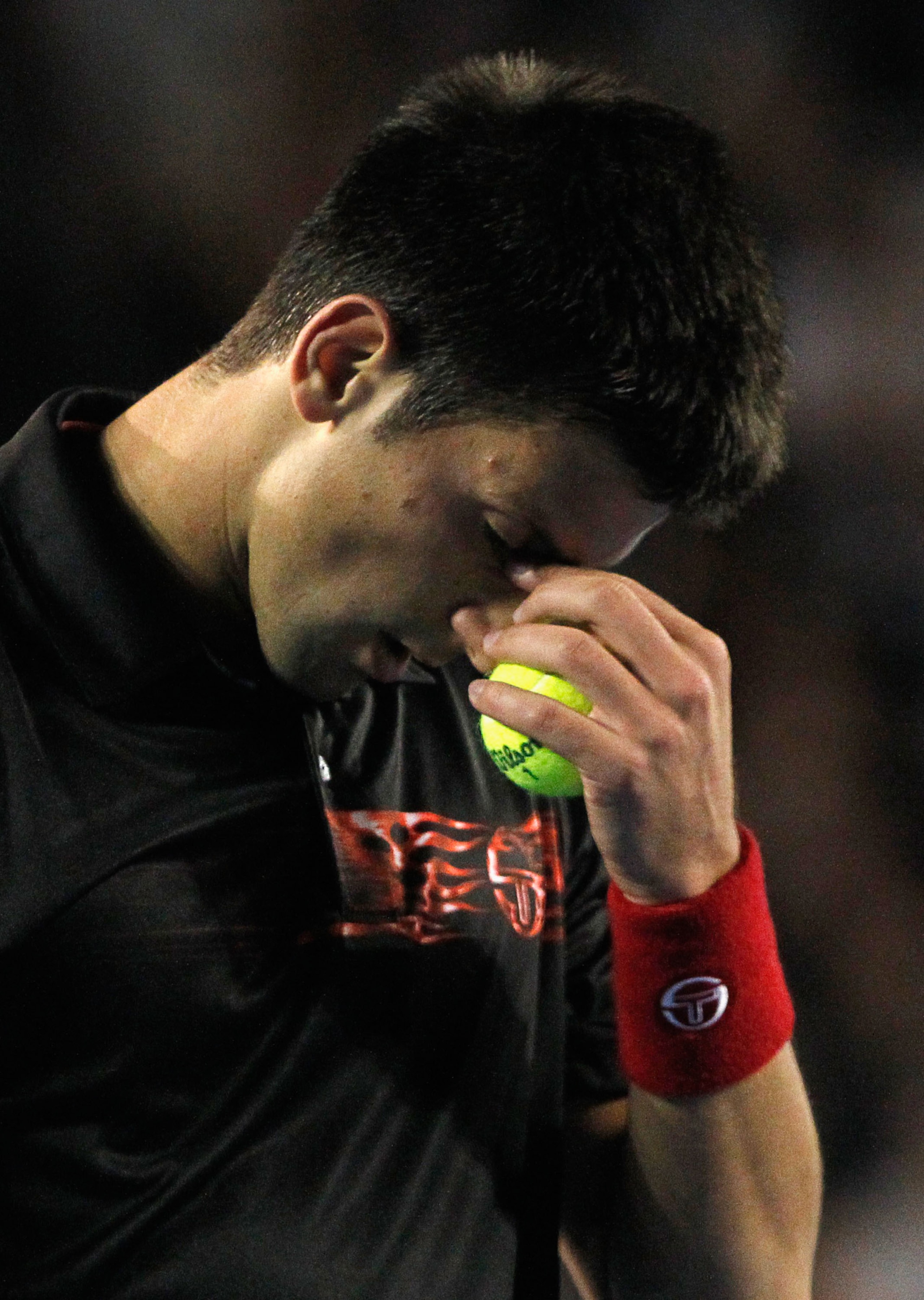 MELBOURNE, AUSTRALIA - JANUARY 27:  Novak Djokovic of Serbia wipes his forehead in his quarterfinal match against Jo-Wilfried Tsonga of France during day ten of the 2010 Australian Open at Melbourne Park on January 27, 2010 in Melbourne, Australia. (Photo